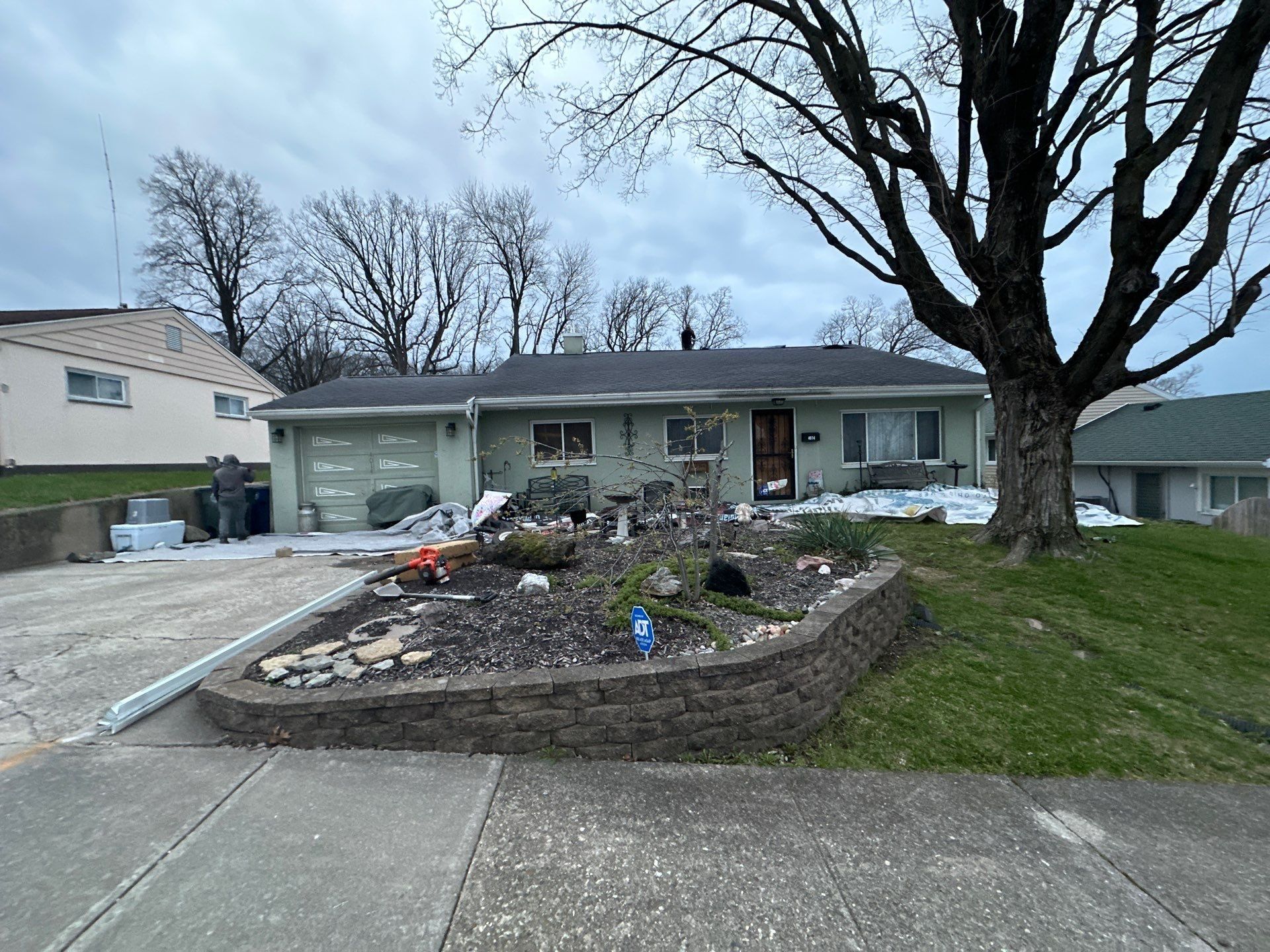 Ground tarps over the beds and patio