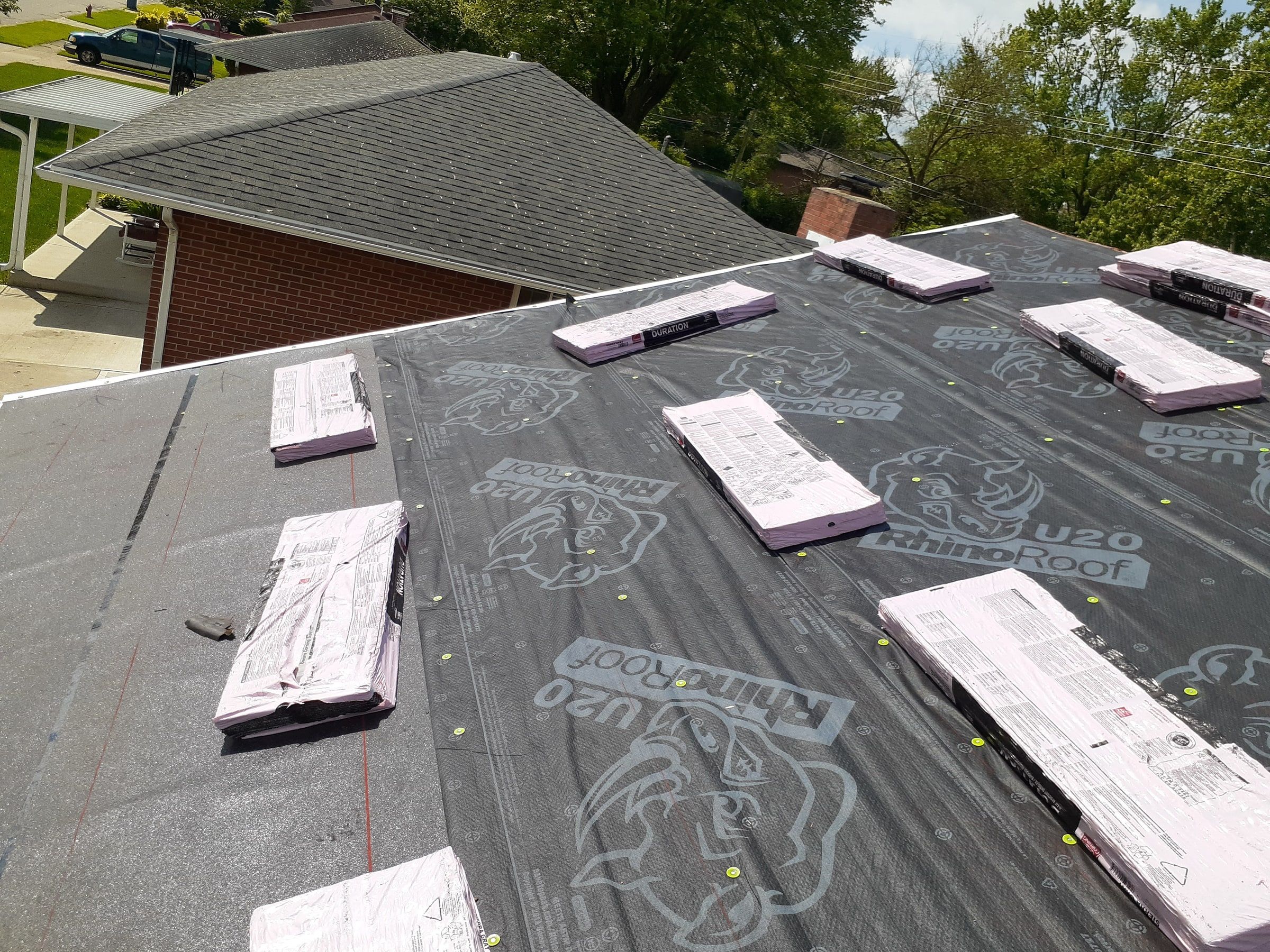 Shingle bundles spread on the underlayment toward the ridge, Huber Heights, Ohio.