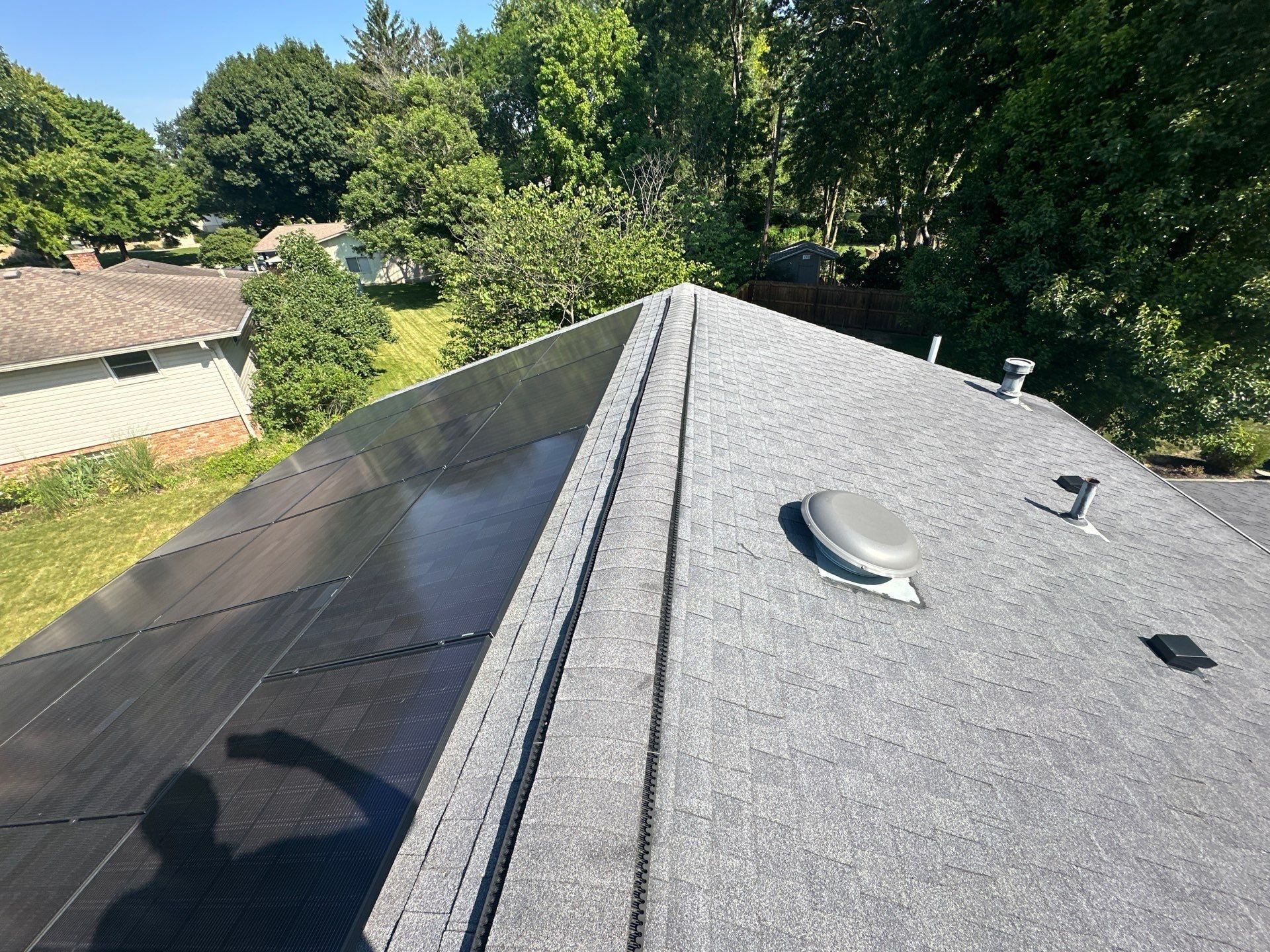 Solar panels beside the ridge vent on the roof, Kettering, Ohio.