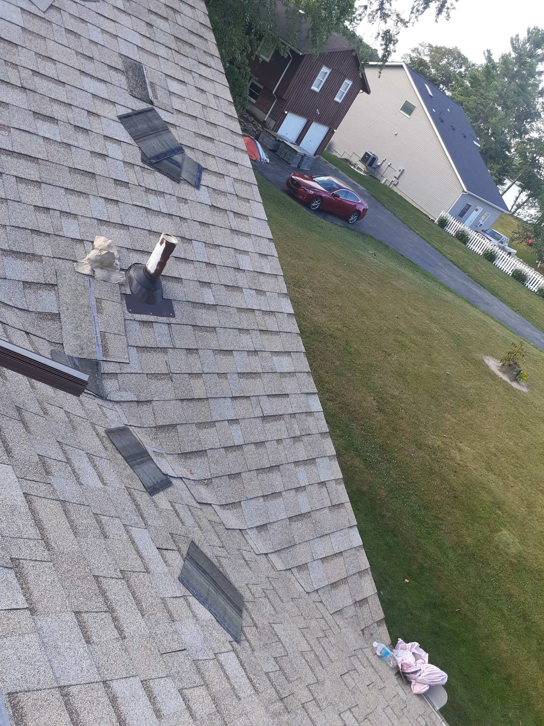 Pipe vent boot set into the new shingles on the side slope, Jamestown, Ohio.