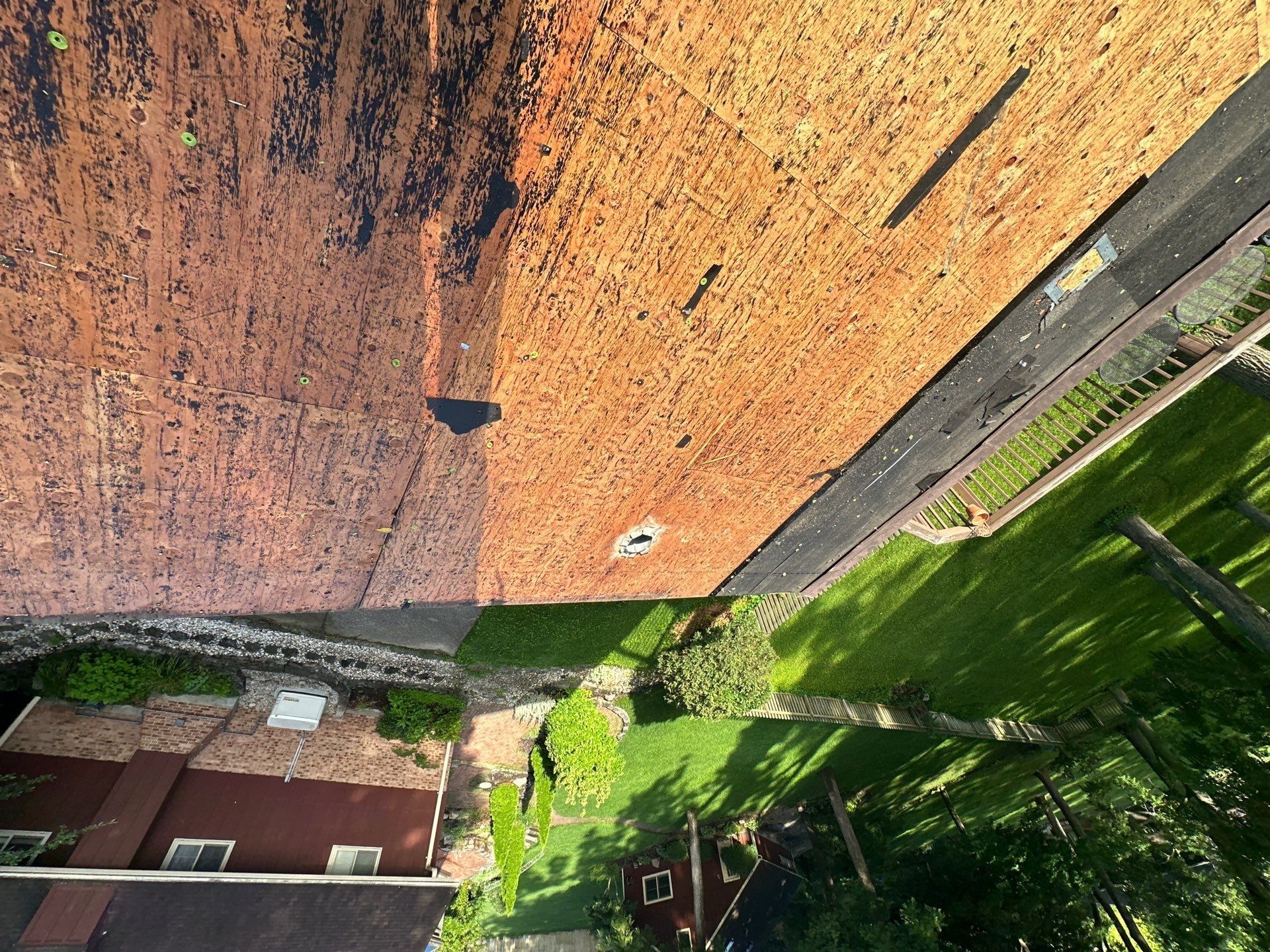 Stripped deck at the eave, garden below