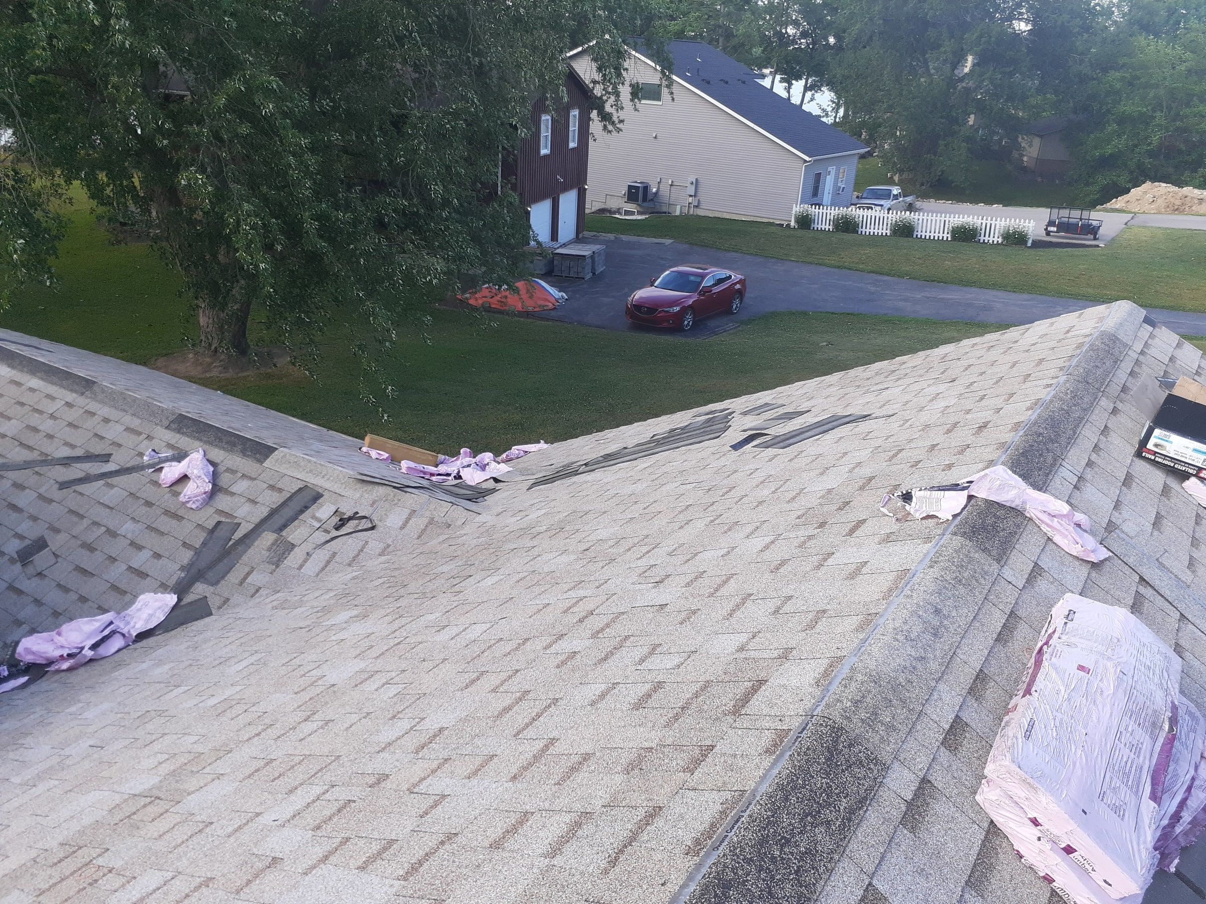 Hip and valley shingled with wrappers left at day end, Jamestown, Ohio.