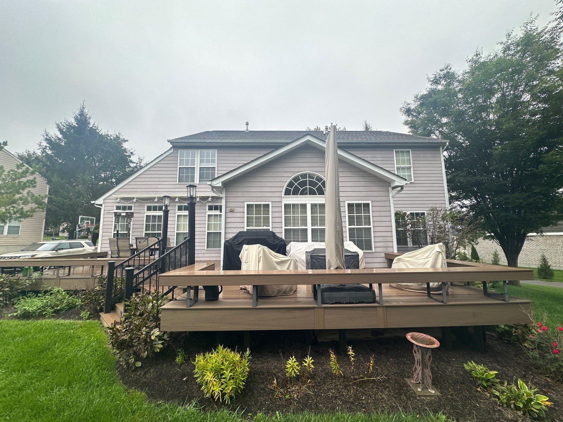 The back of the house with its arched window above the deck, Beavercreek, Ohio.