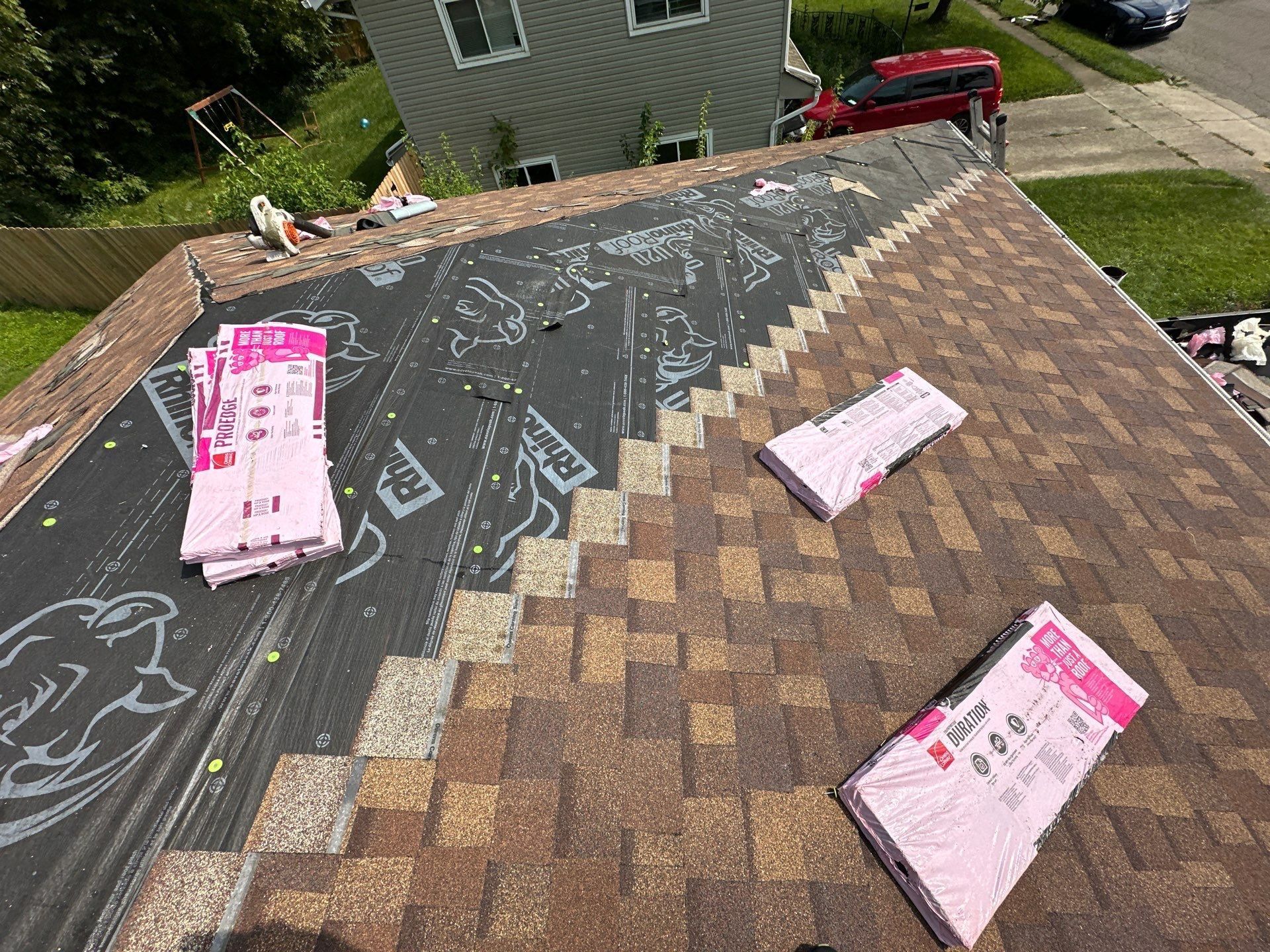 Duration shingles going on from the eave, with bundles staged above, Fairborn, Ohio.