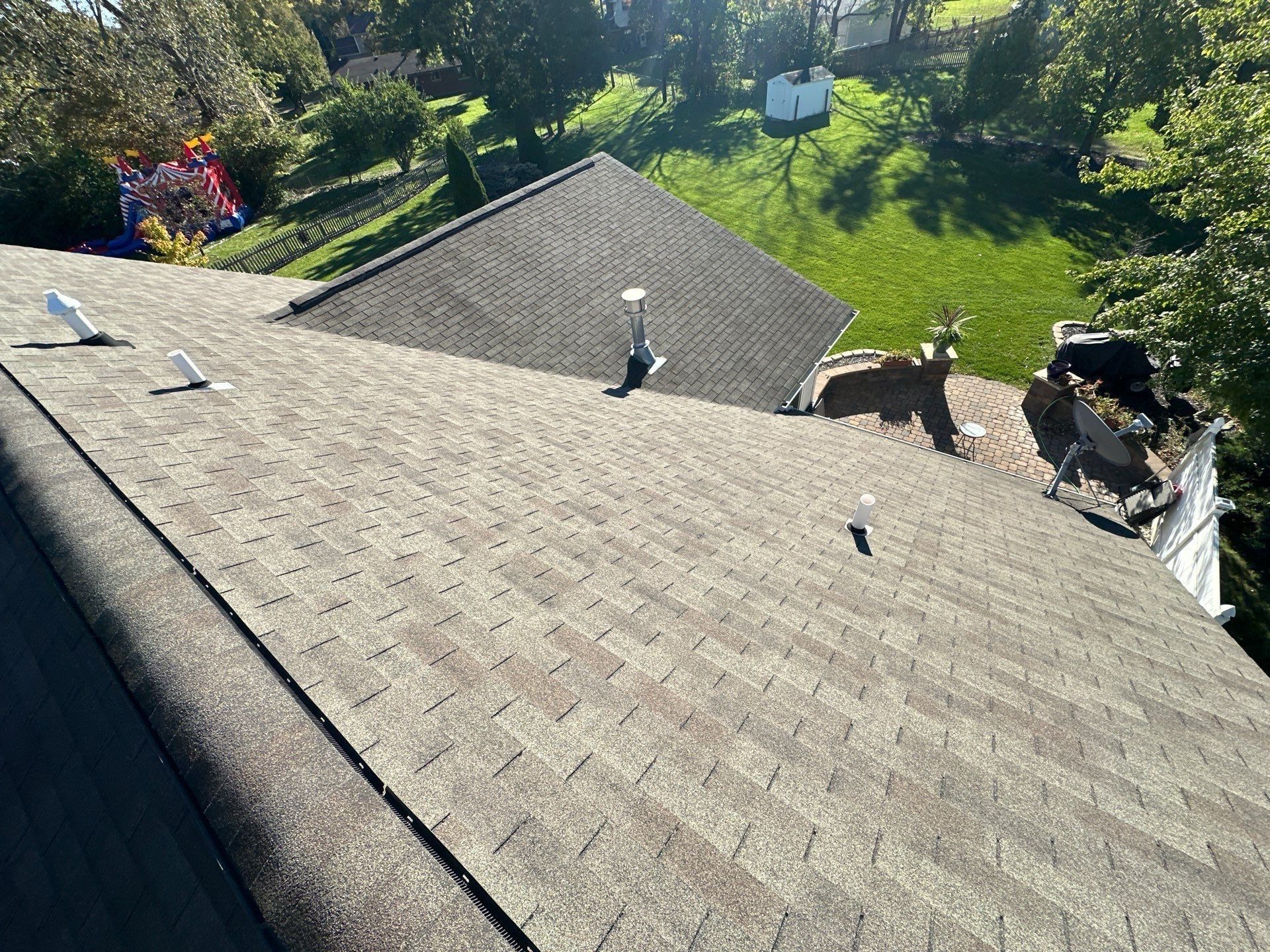 The old shingles and vents on the back slope, the back yard beyond, Beavercreek, Ohio.