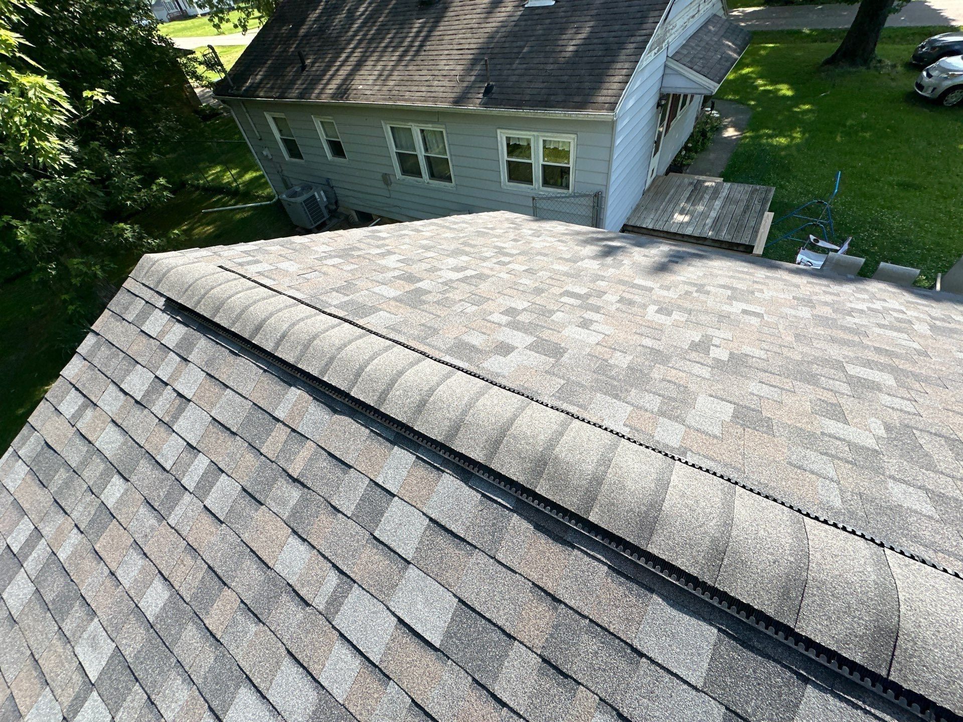 New shingles above the old siding