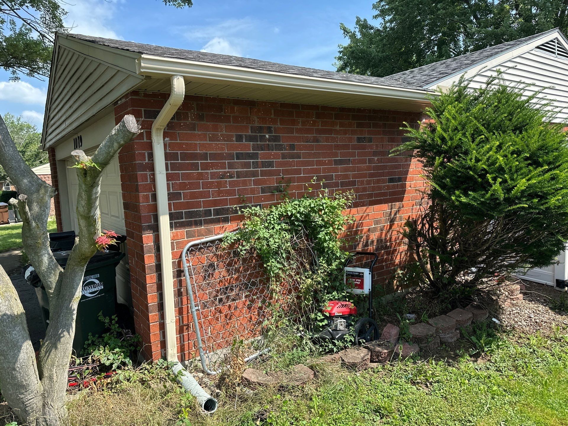 A new downspout on the side of the brick garage, Xenia, Ohio.