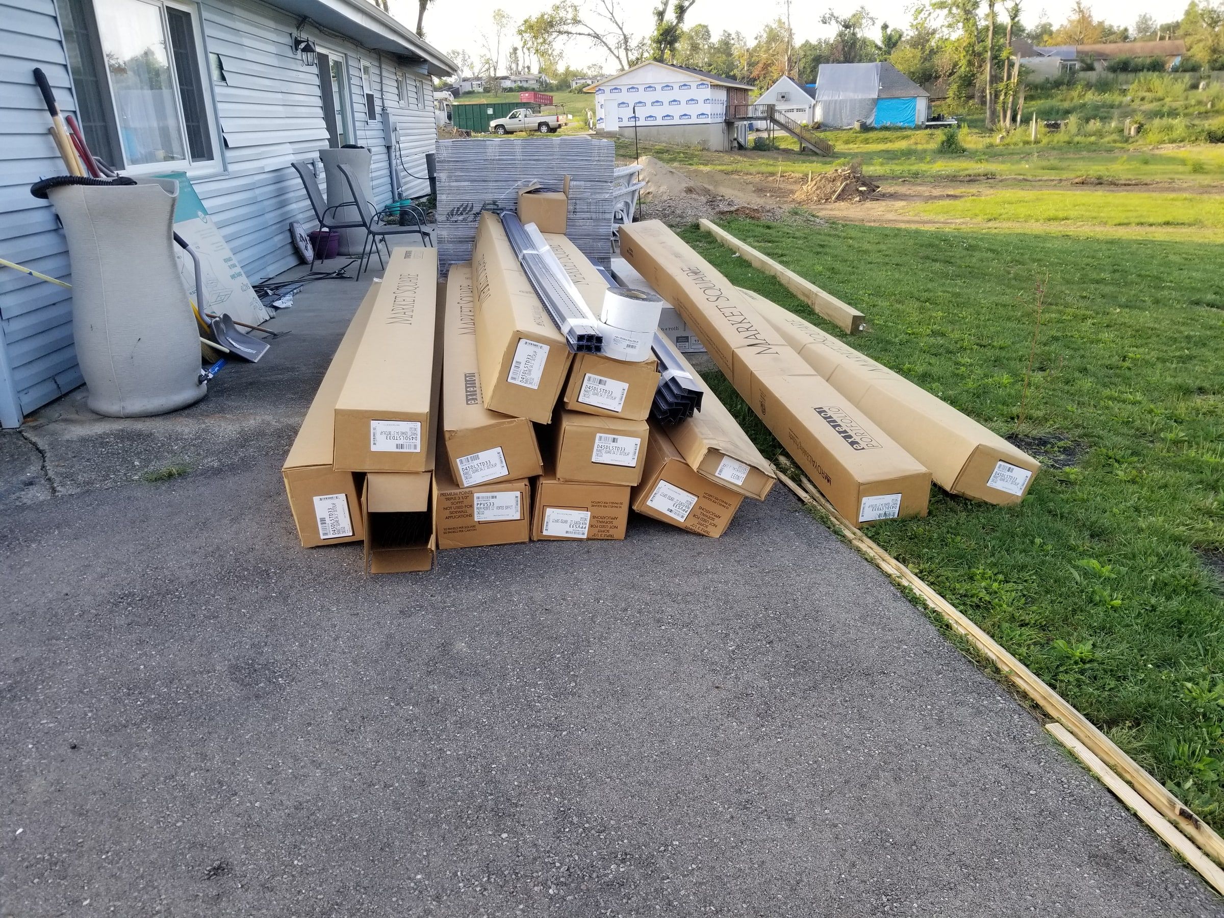 Siding boxes laid out on the driveway beside the house, Beavercreek, Ohio.
