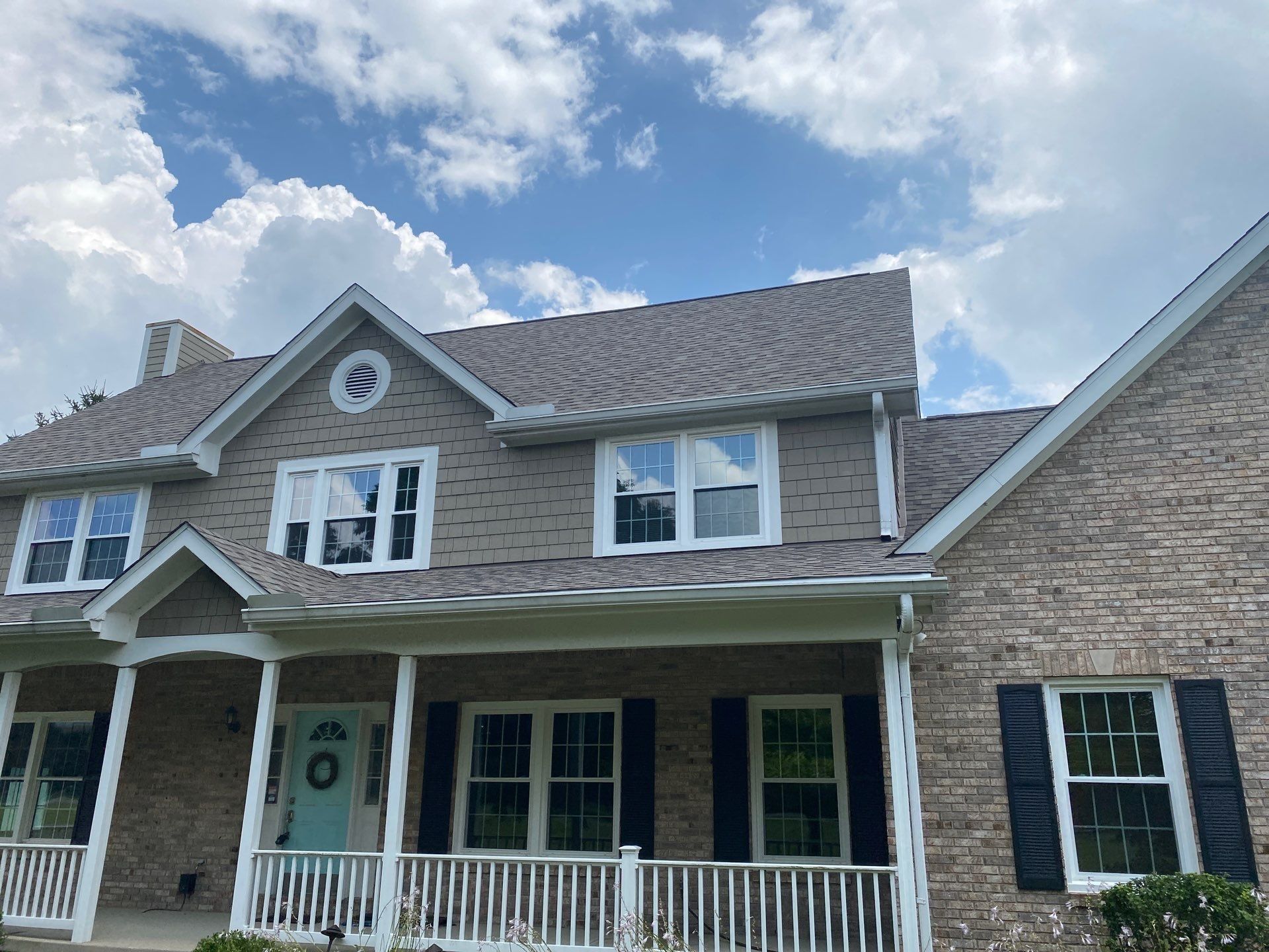 Front of the home with the finished roof over the porch and dormers, Yellow Springs, Ohio.