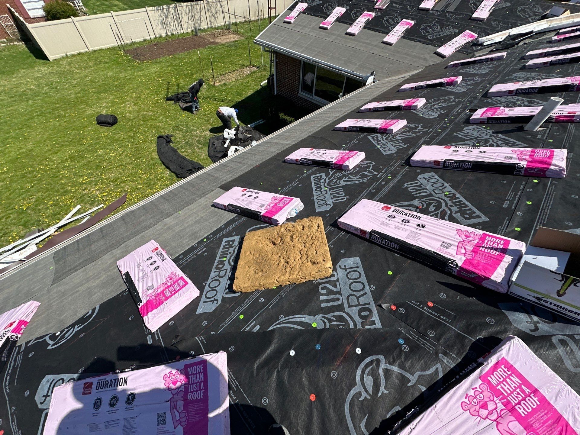 Shingle bundles labeled Duration spread across the underlayment, Beavercreek, Ohio.