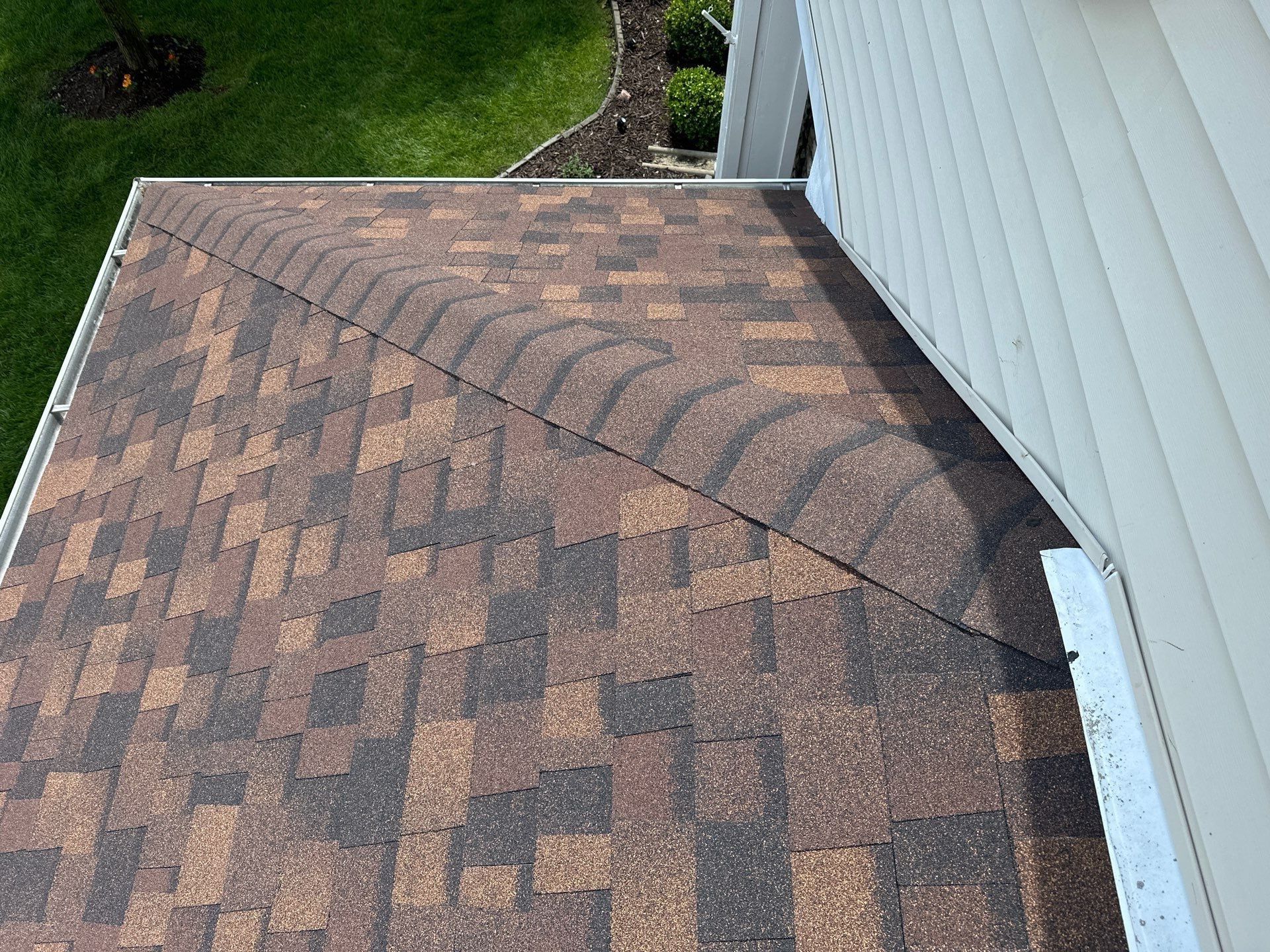 New shingles along the wall flashing at the side of the house, Beavercreek, Ohio.