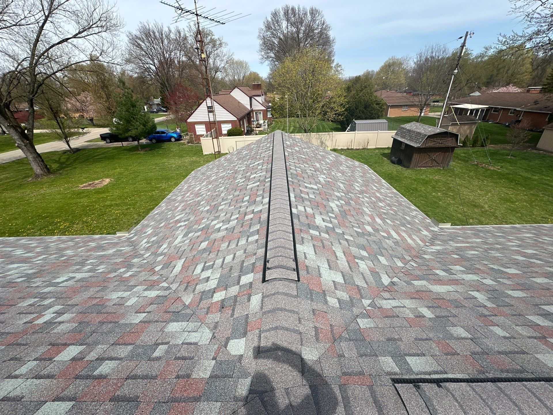 Long ridge vent capped with matching ridge shingles down the peak, Beavercreek, Ohio.