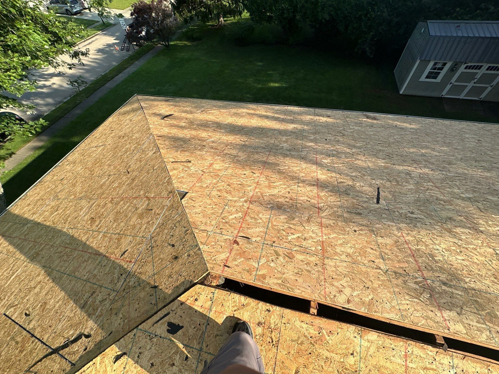The clean deck at a hip, looking out over the back yard and shed, Dayton, Ohio.