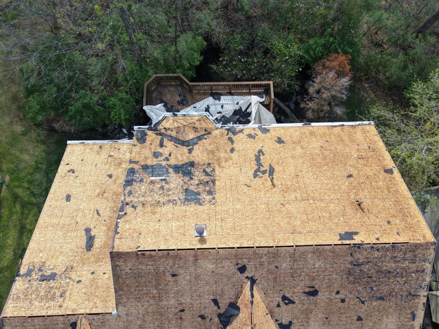 Whole roof to bare sheathing from above