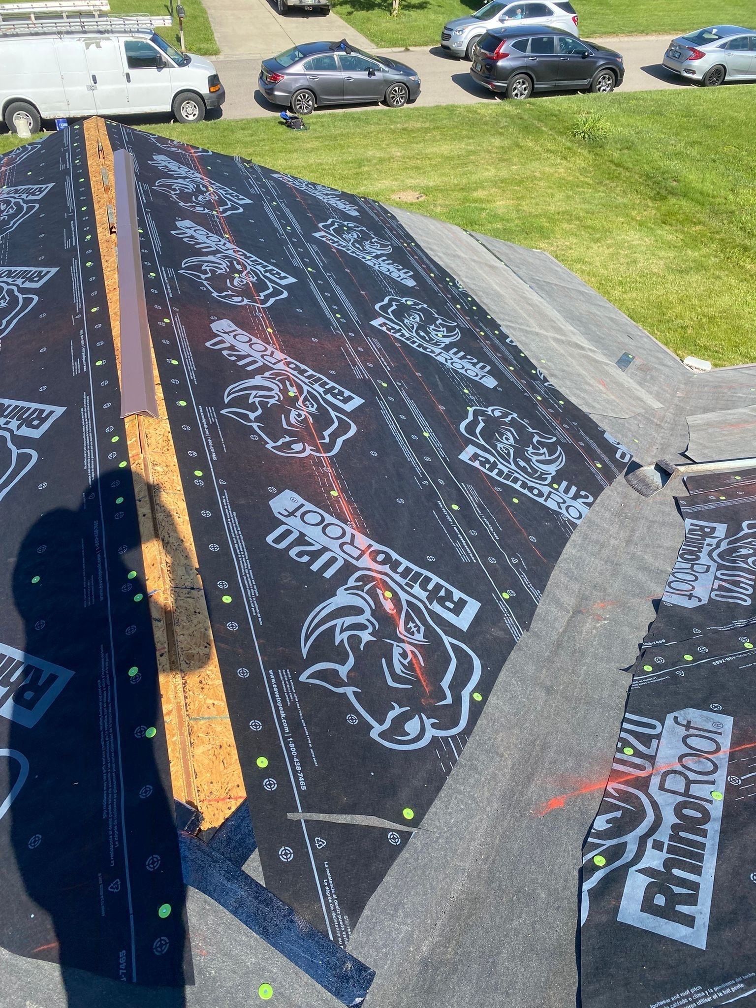 Synthetic underlayment over the hips, with the ridge left open for the vent, Beavercreek, Ohio.