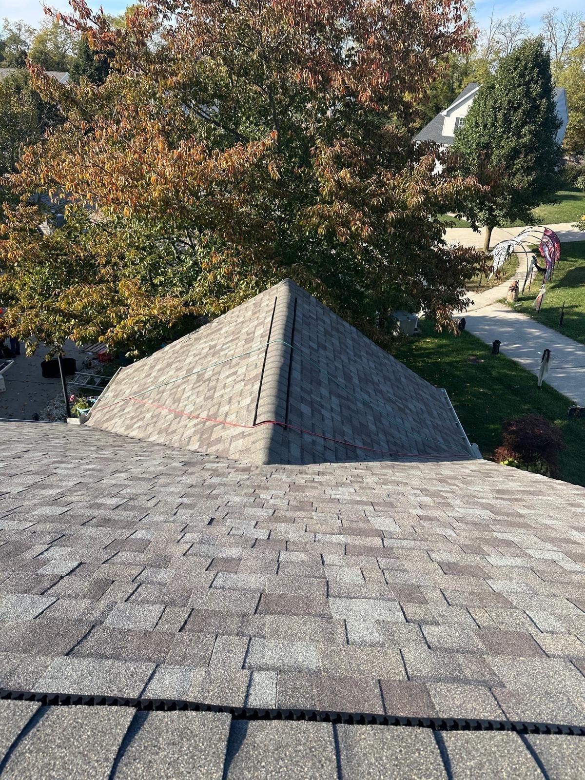 A finished gable meeting the main roof, the ridge cap in front, Beavercreek, Ohio.