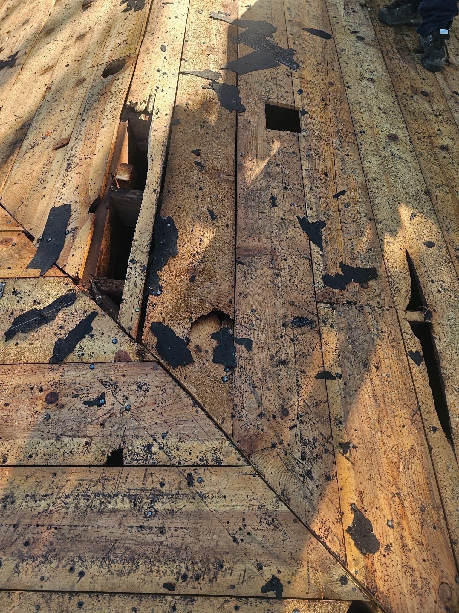 Broken boards where two slopes of the plank deck meet, Kettering, Ohio.