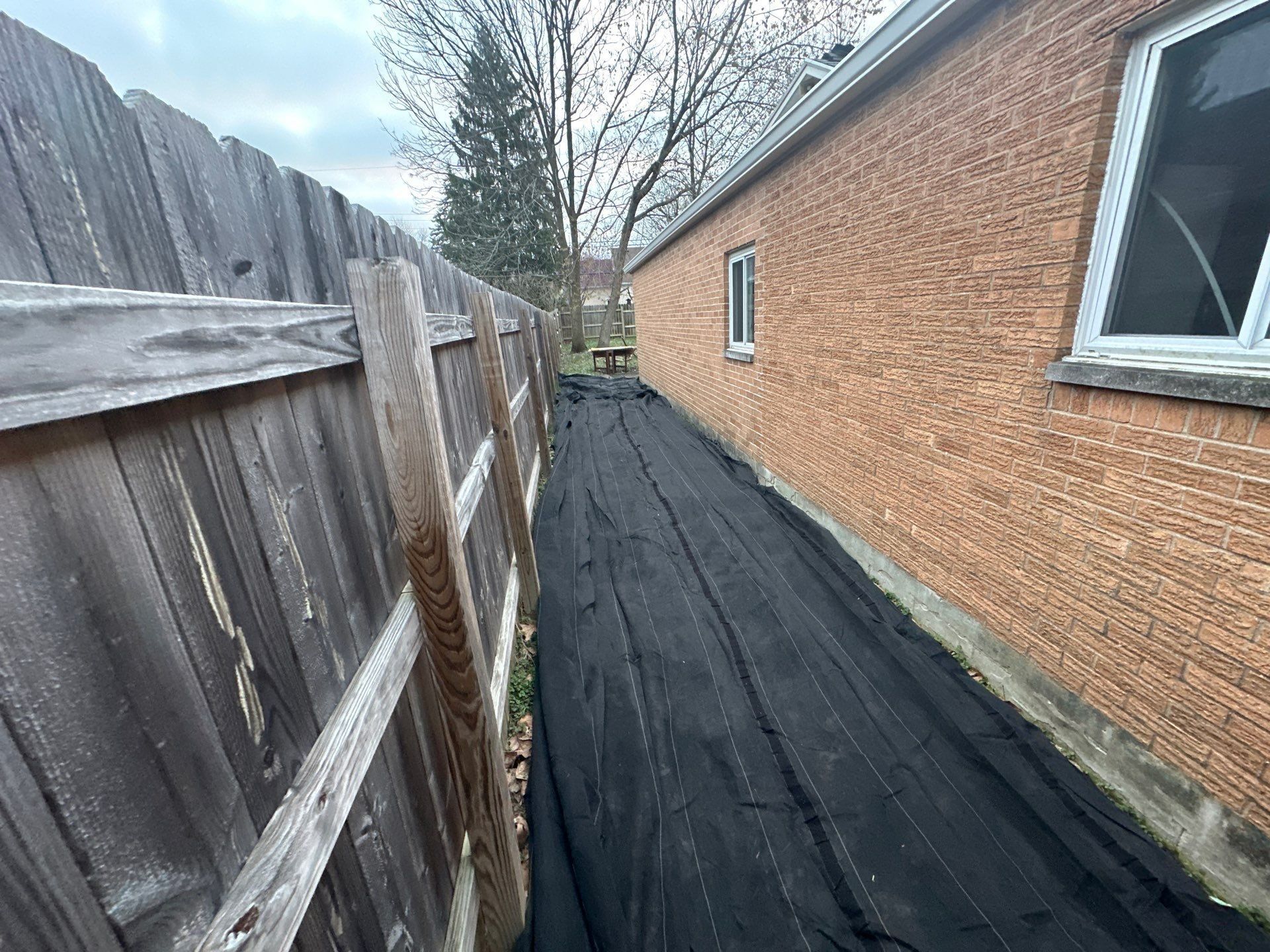 Sheeting along the length of the elevation