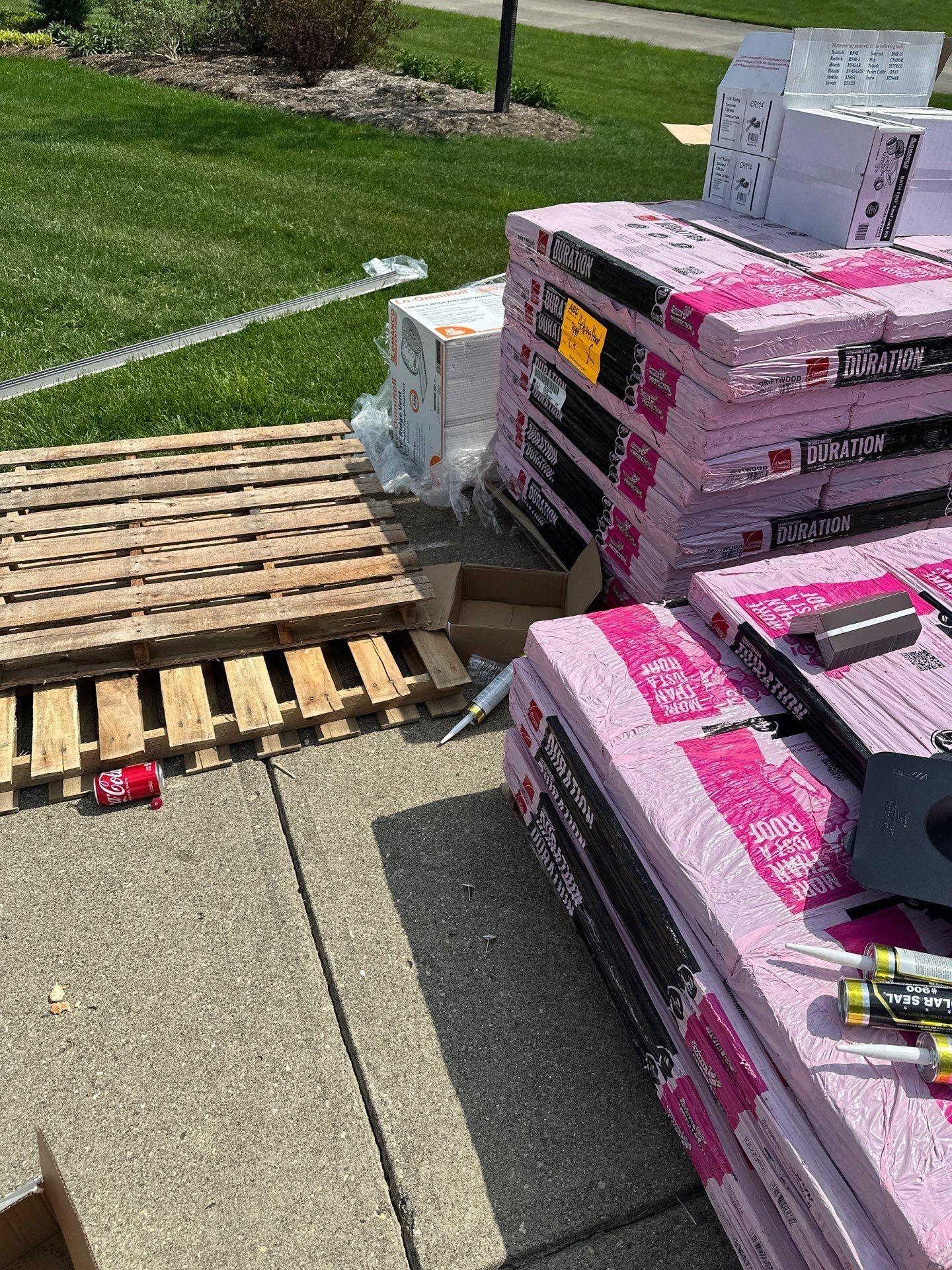 Duration shingle bundles stacked on pallets on the driveway, Beavercreek, Ohio.