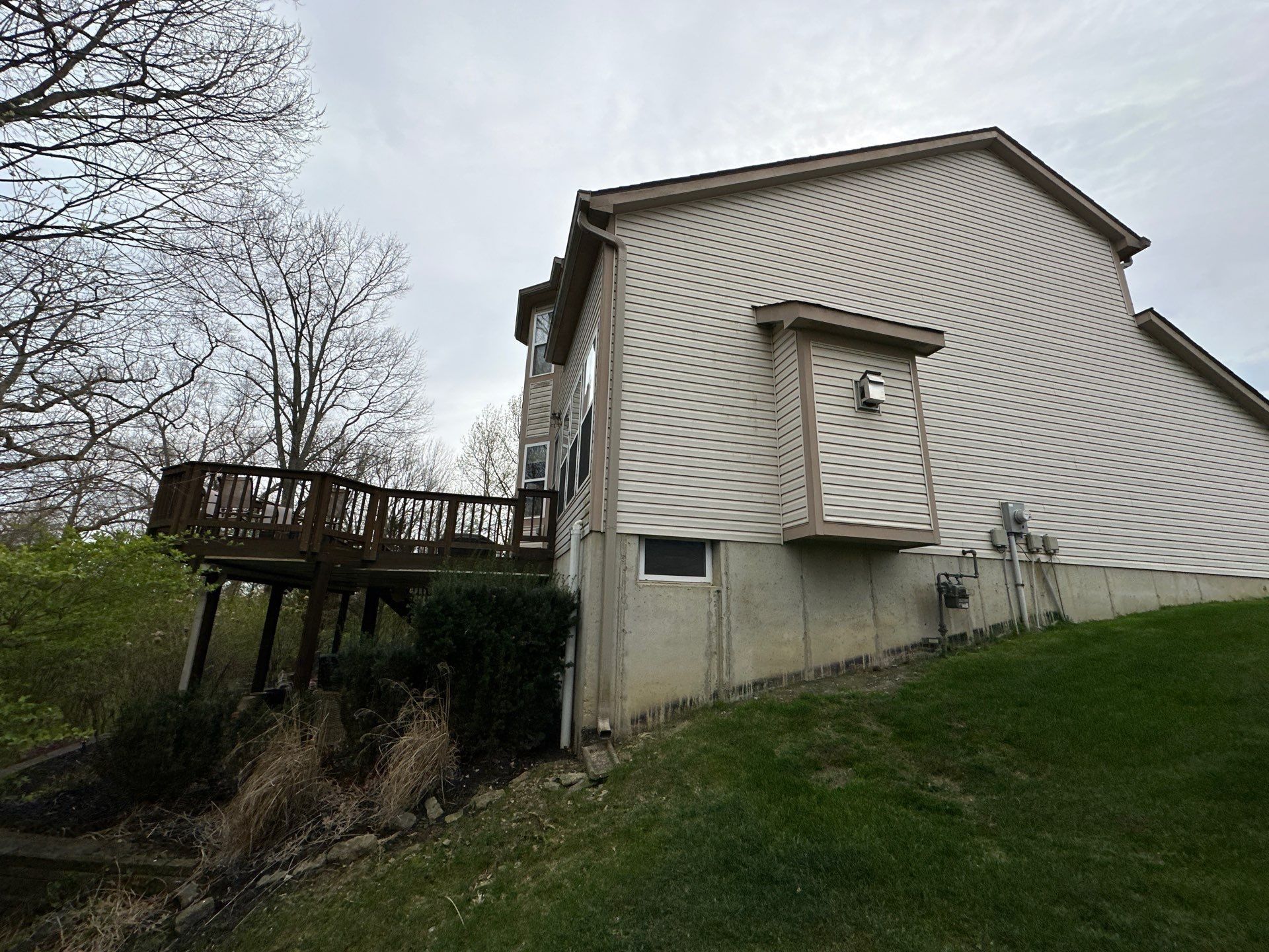 End wall and raised deck under gray sky