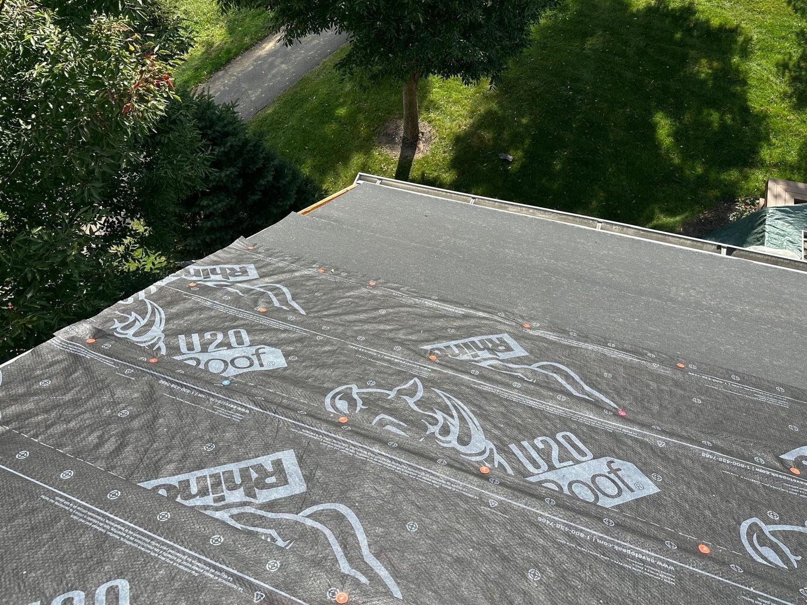 RhinoRoof U20 synthetic underlayment nailed across the slope, Beavercreek, Ohio.