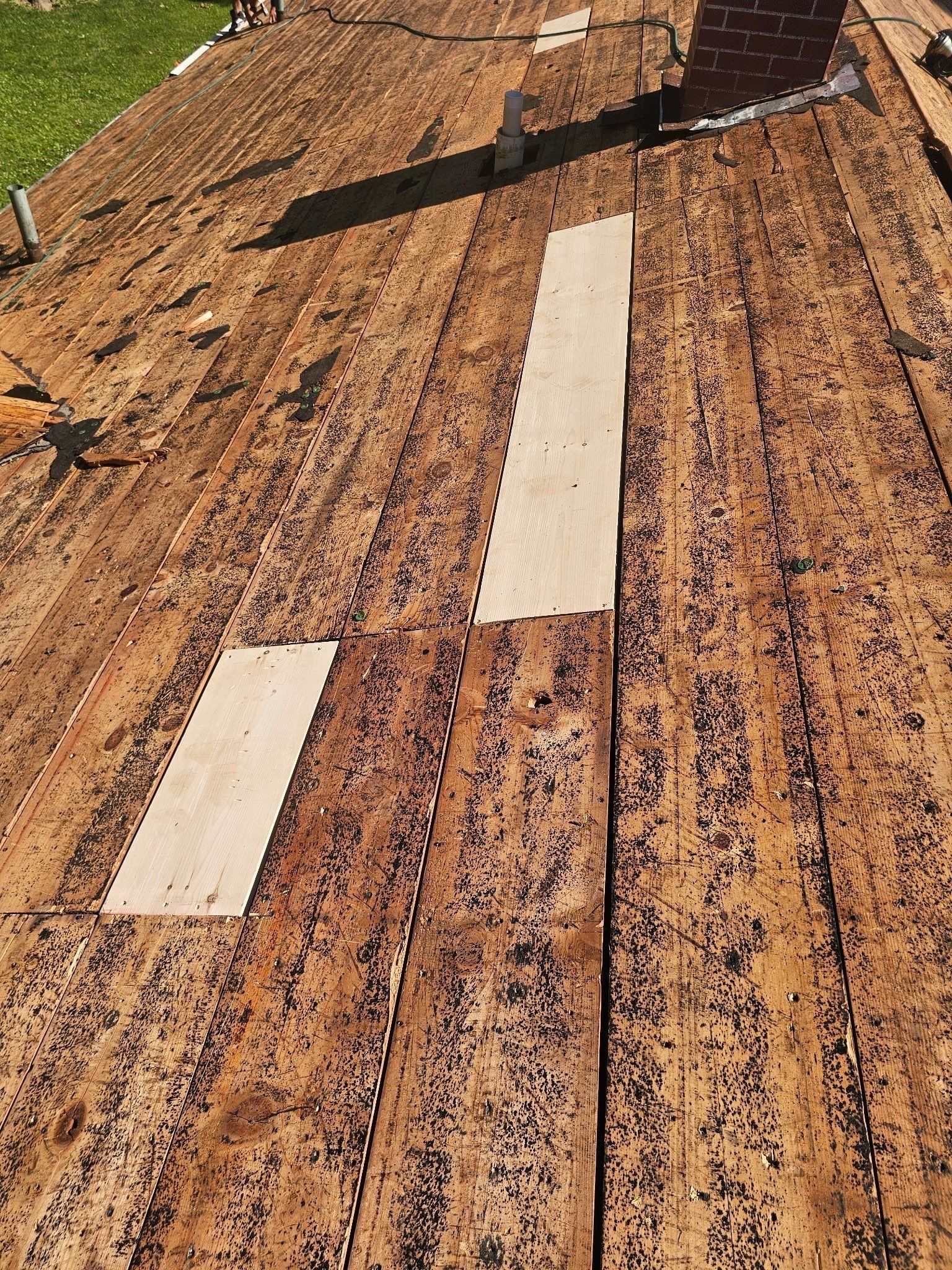 Two new boards below the chimney
