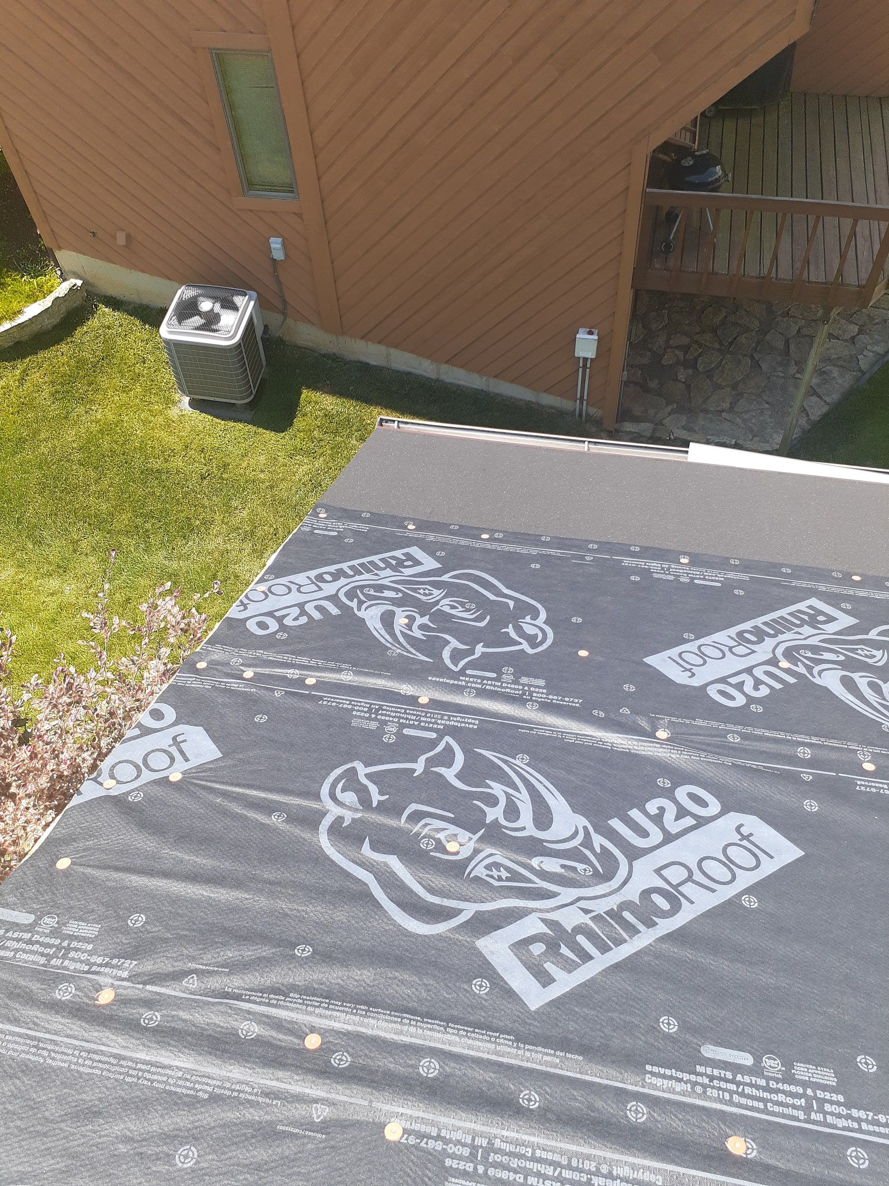 RhinoRoof U20 synthetic underlayment rolled out along the lower edge, Jamestown, Ohio.