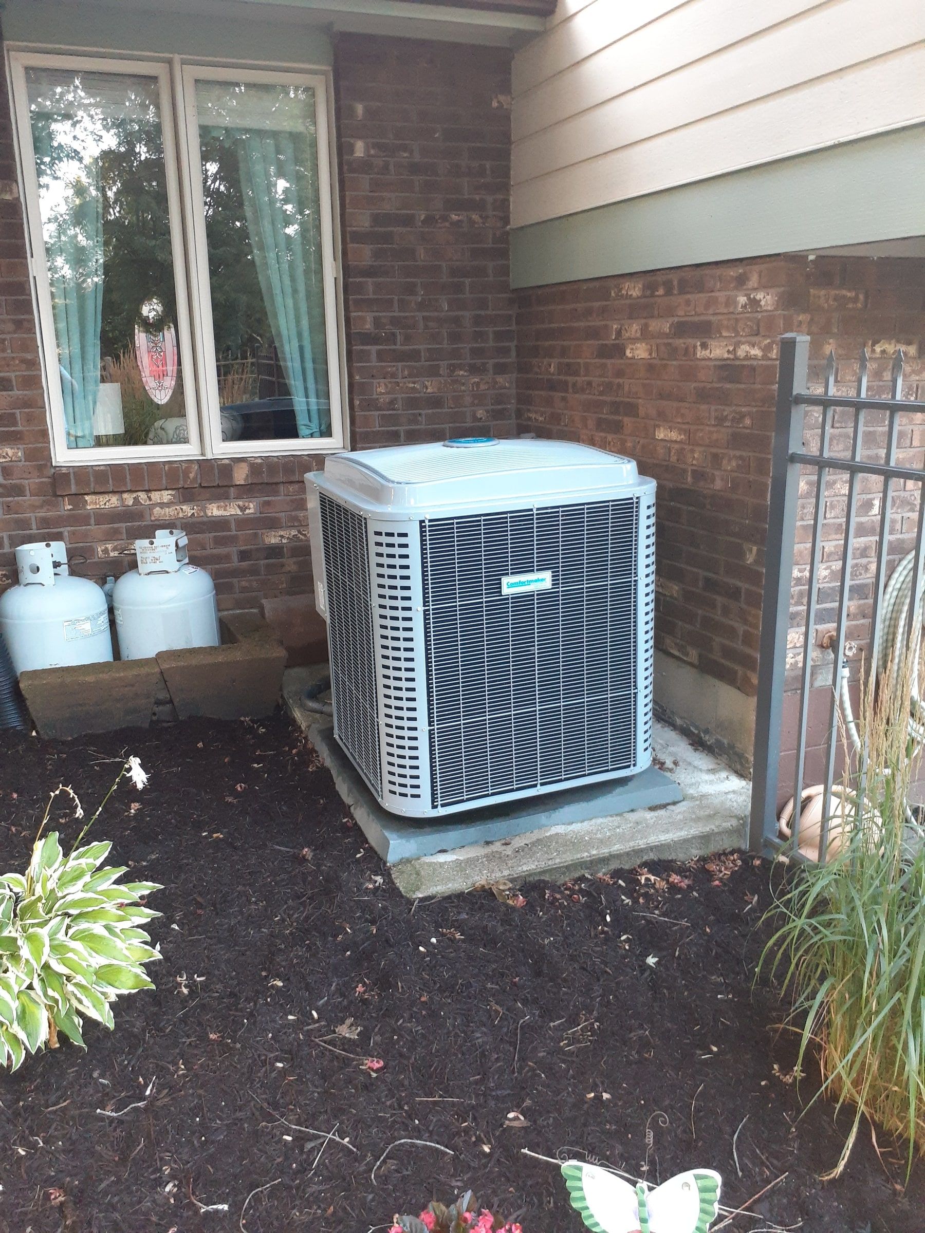 Air conditioner and tanks beside the house, noted before work started, Jamestown, Ohio.