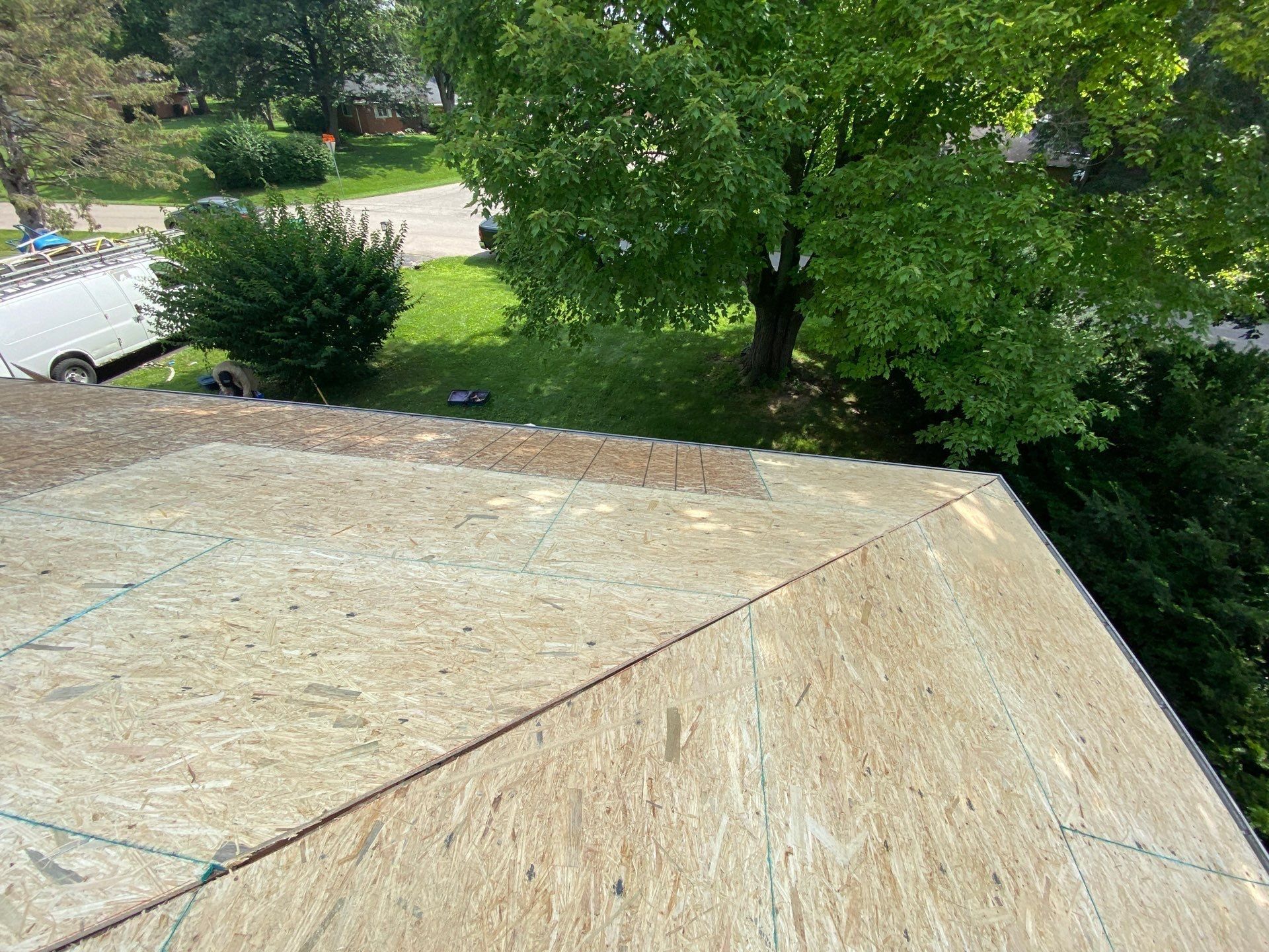 Fully sheathed hip corner with new panels over the old deck, Beavercreek, Ohio.
