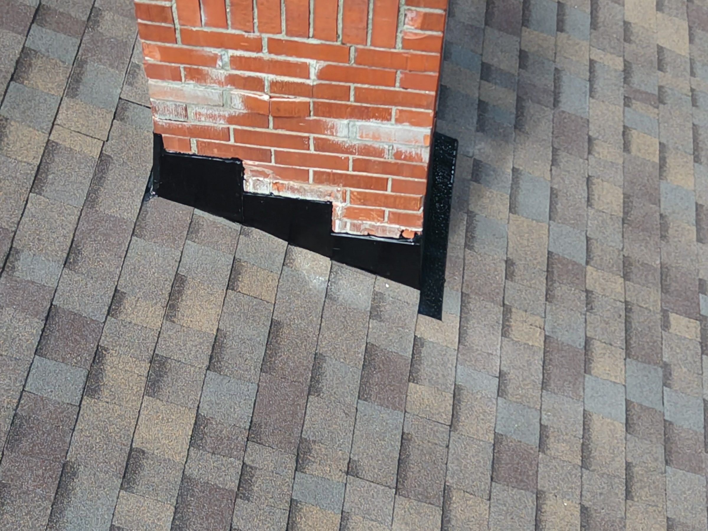 Step flashing in the brick courses