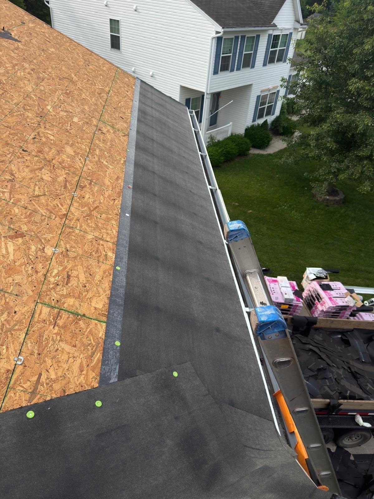 New sheathing and edge metal at the eave