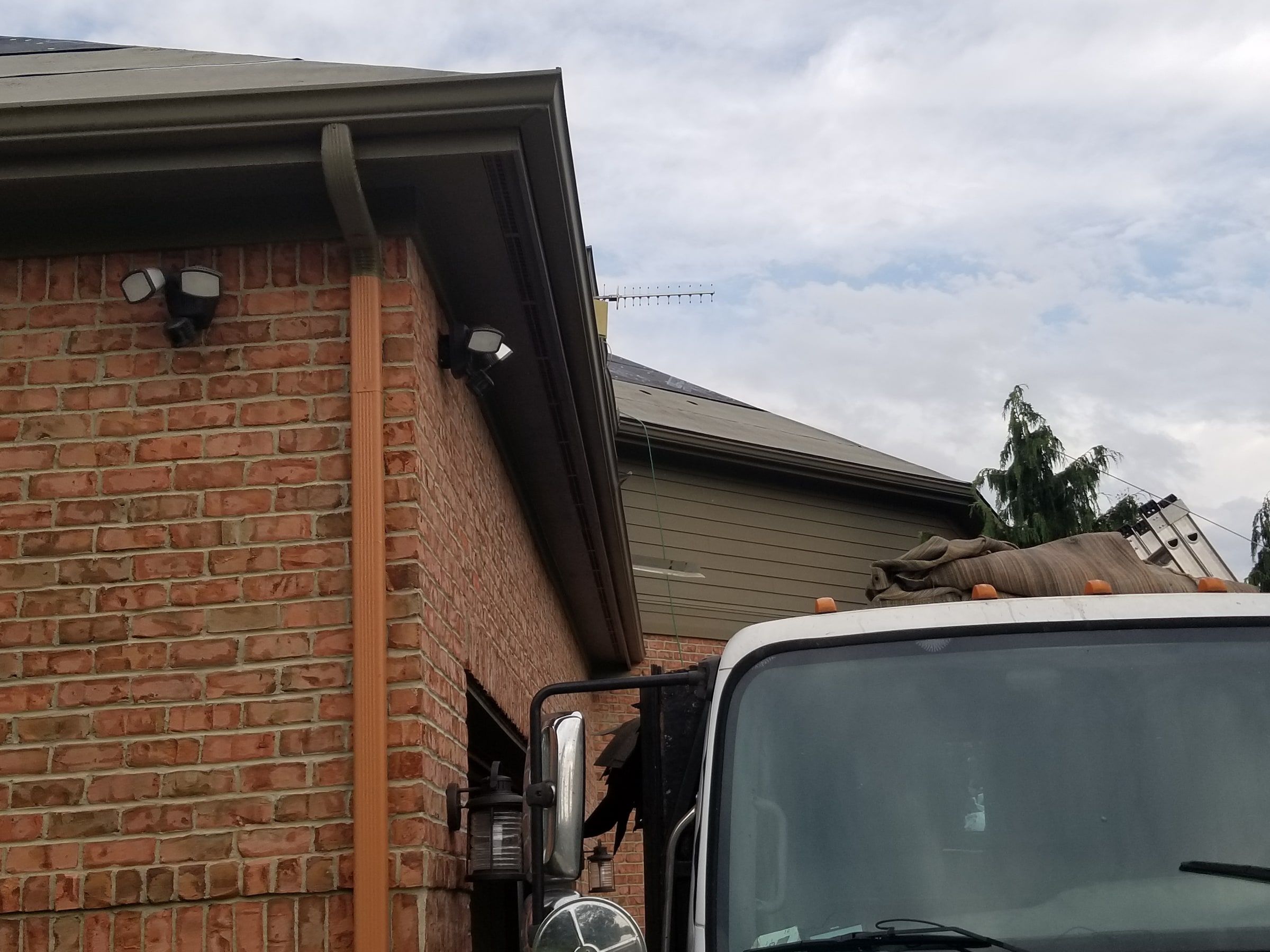 Dump truck at the brick gable