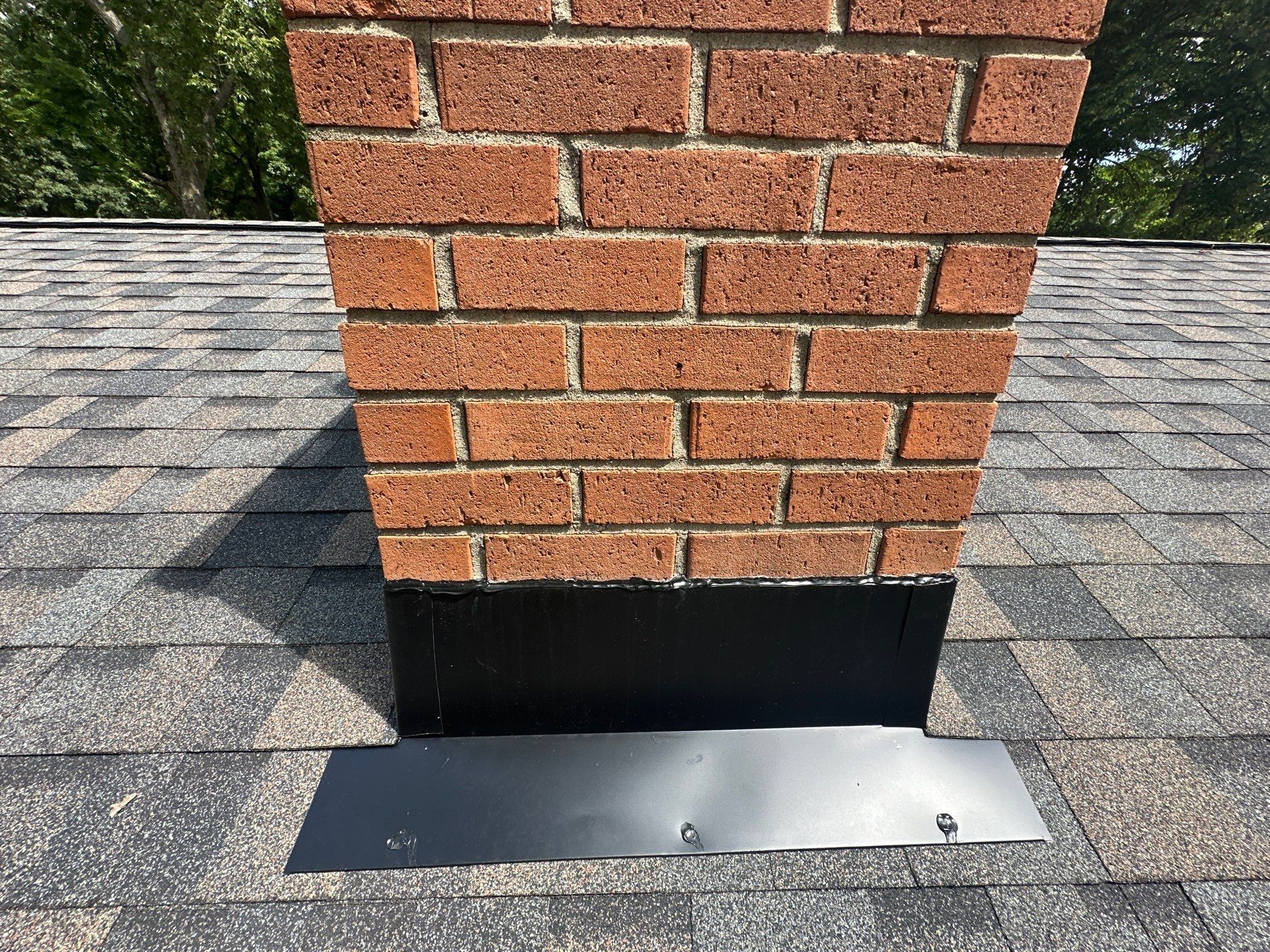 Chimney base, flashing and apron close