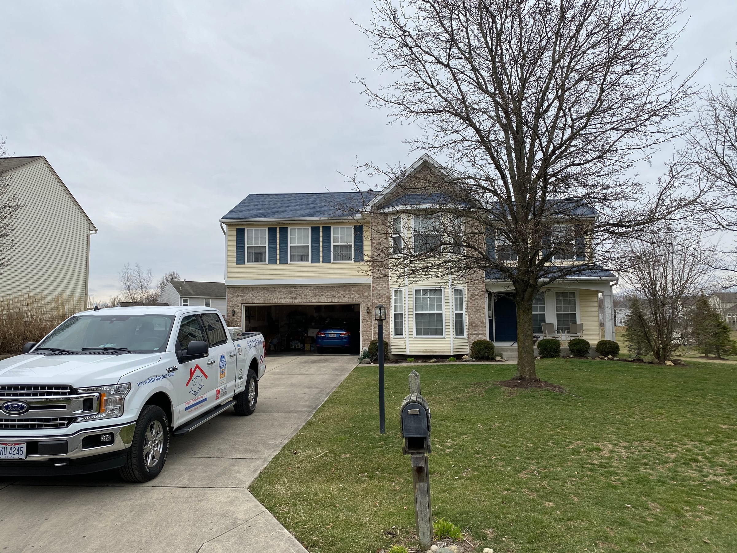Two-story house and the work truck