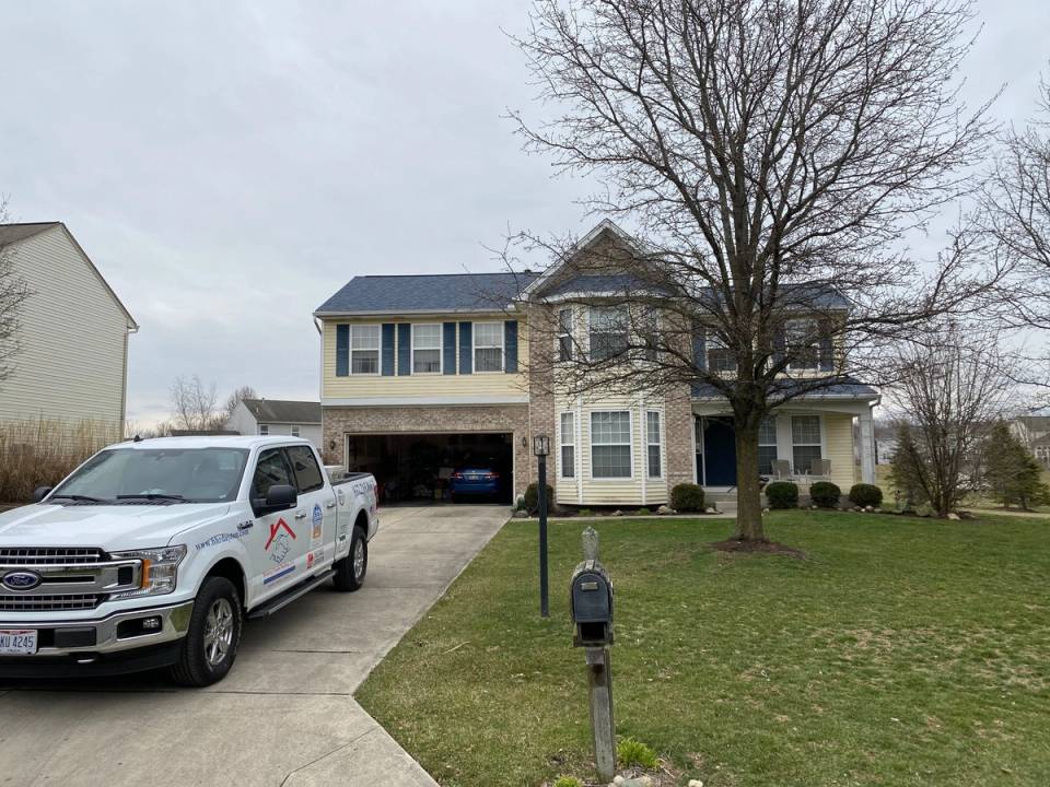 Two-story house and the work truck