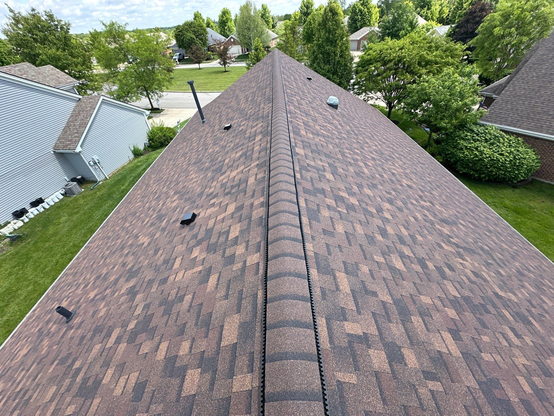 Finished wind damage roof replacement seen from the ridge, Xenia, Ohio.