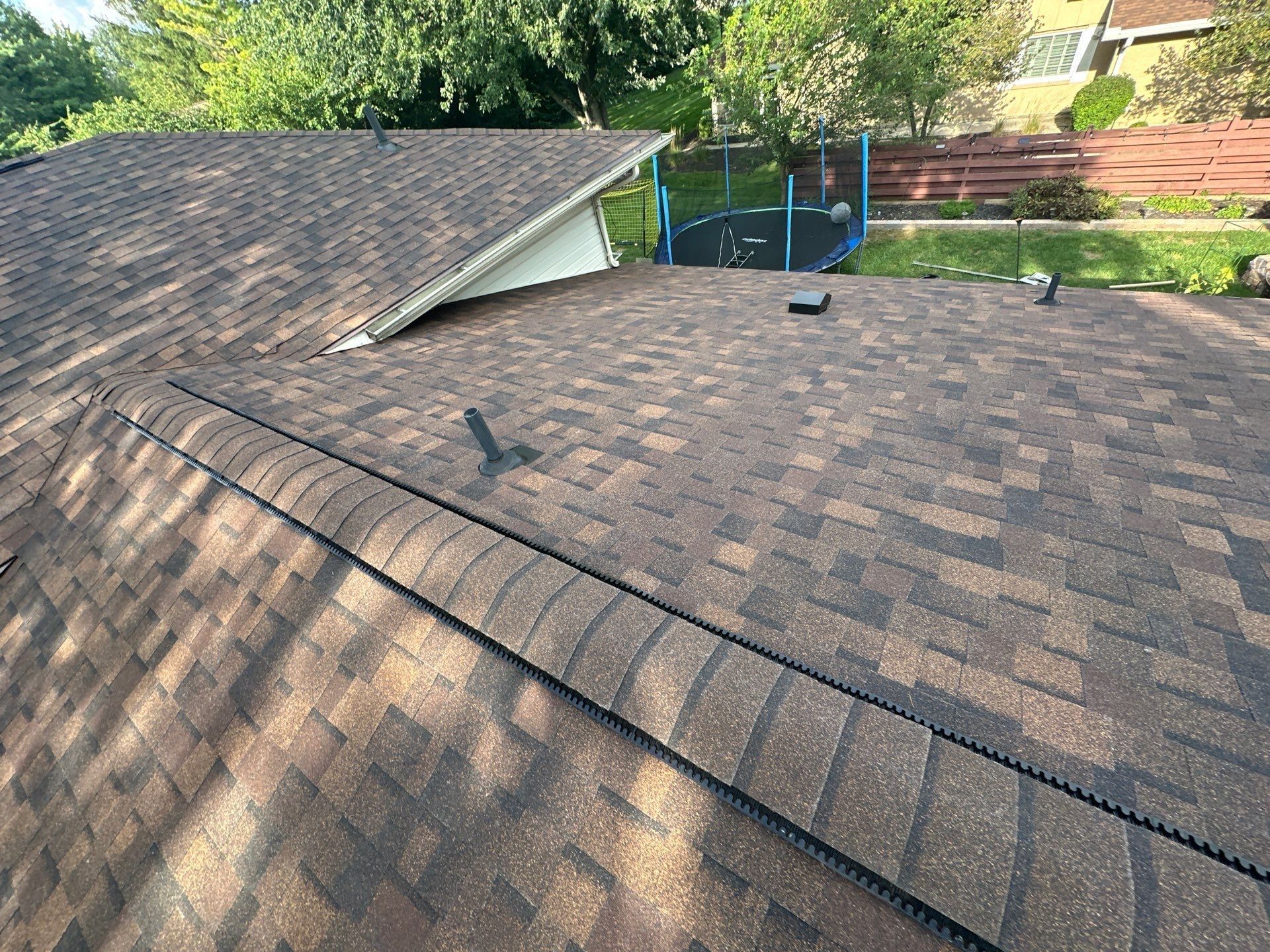 Finished ridge vent and a vent pipe on the back slope, Dayton, Ohio.