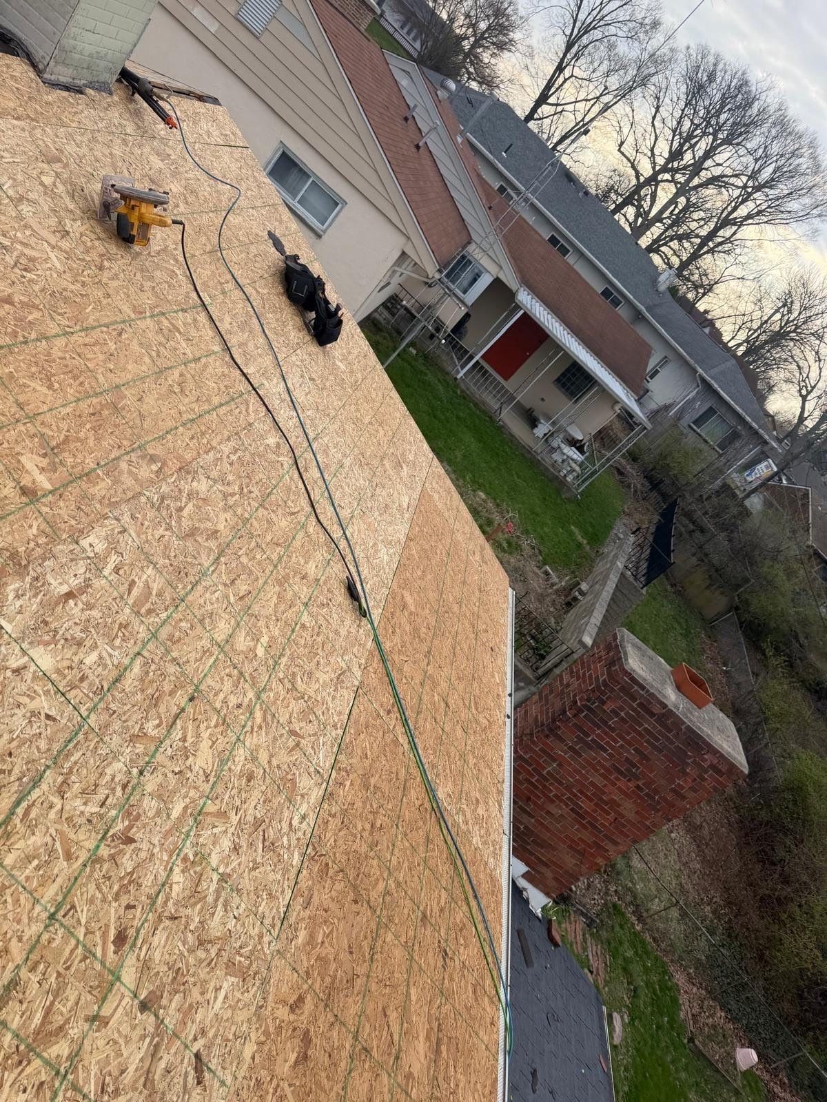 New OSB on the back slope above the brick chimney, Dayton, Ohio.