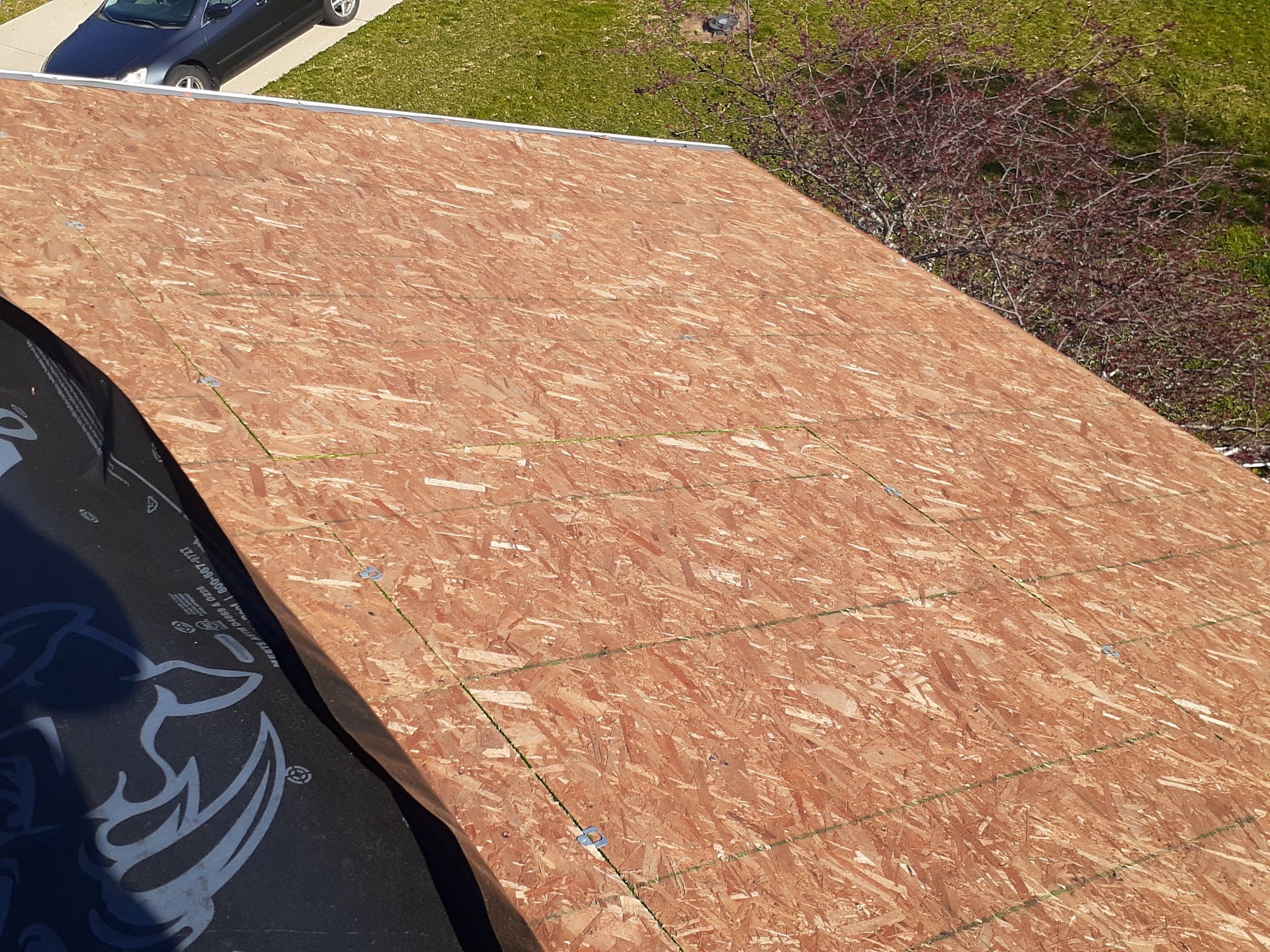 Bare OSB deck swept clean down to the roof edge, Xenia, Ohio.