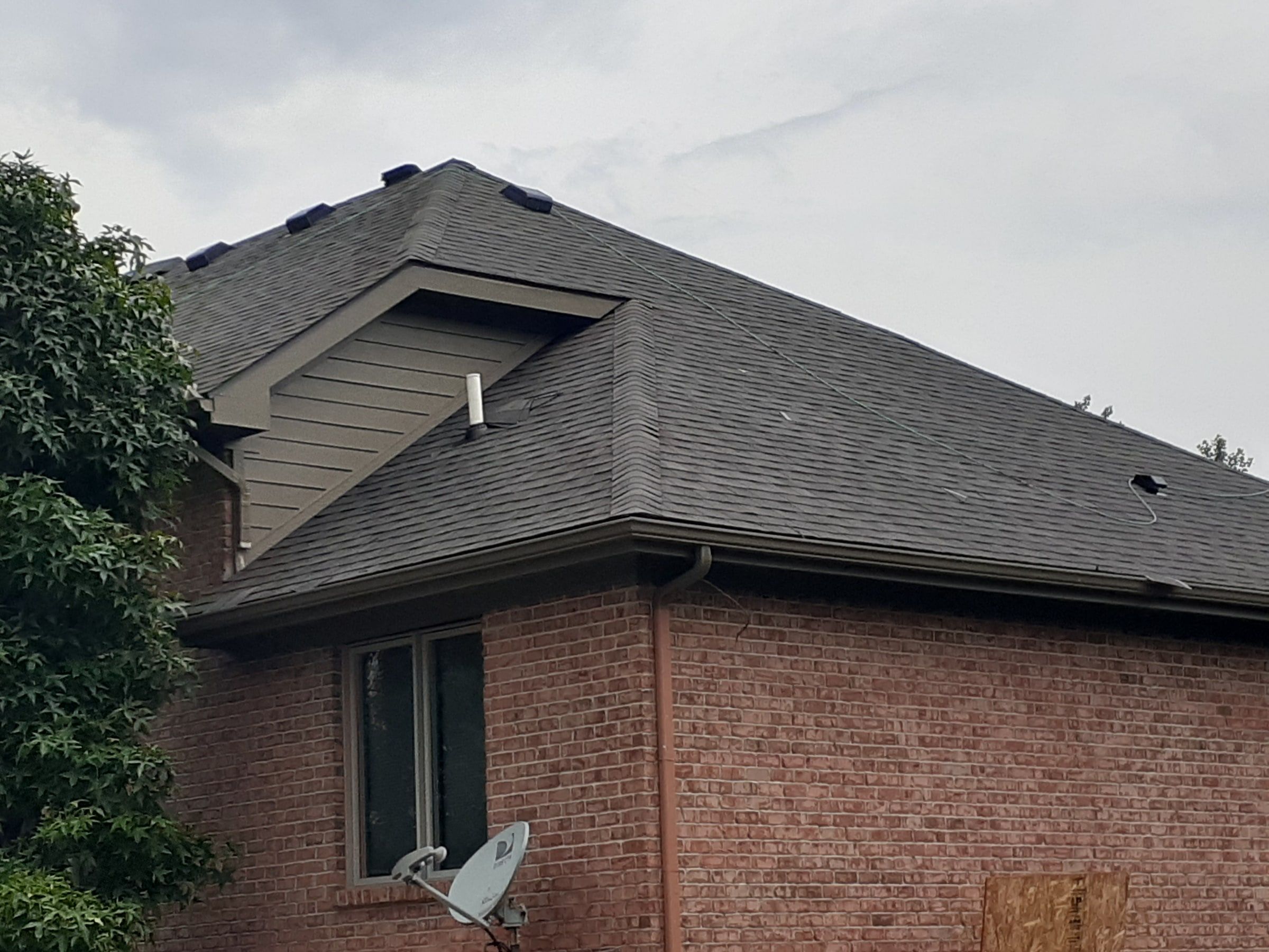 Dormer and rear planes of the brick house
