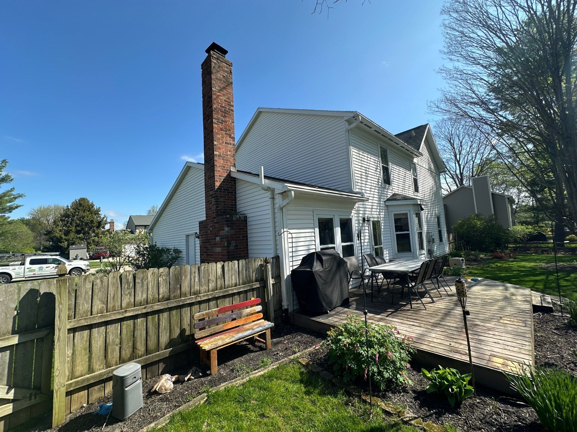 Rear elevation, brick chimney and deck