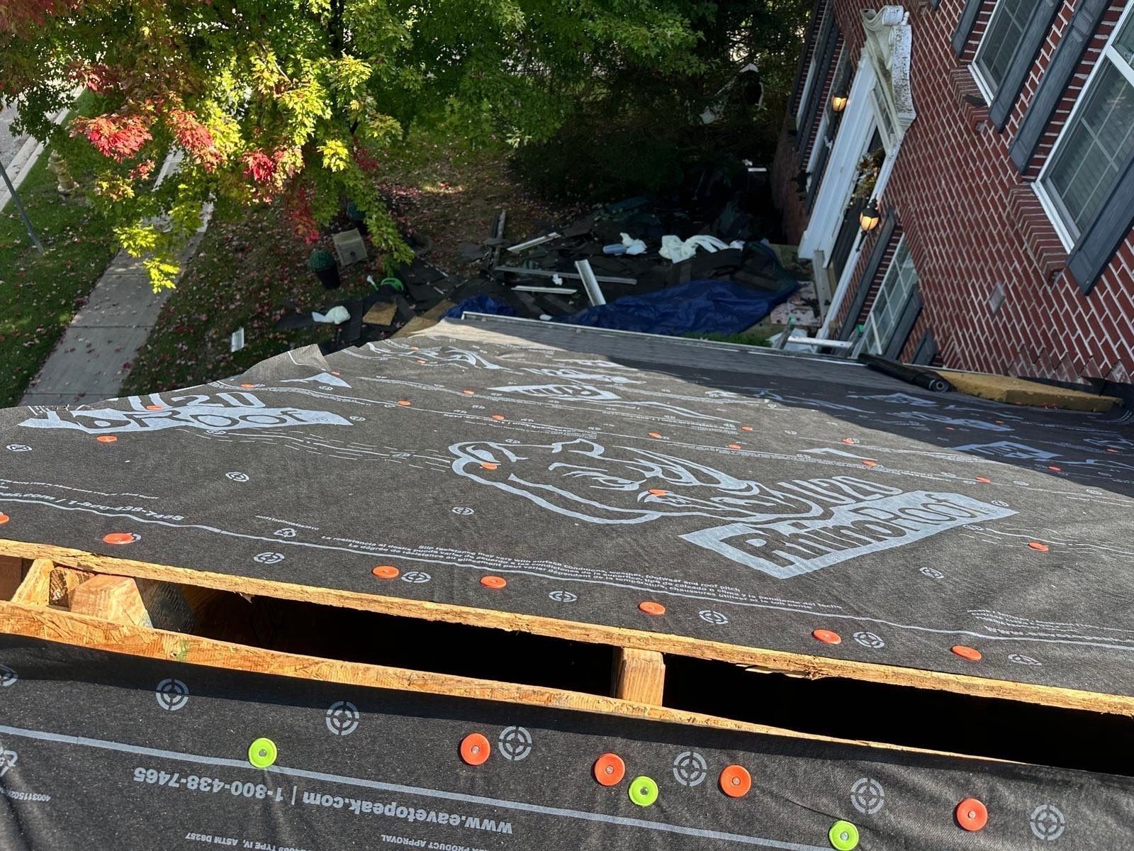 A gap along the lower edge of the deck, with underlayment above it, Beavercreek, Ohio.