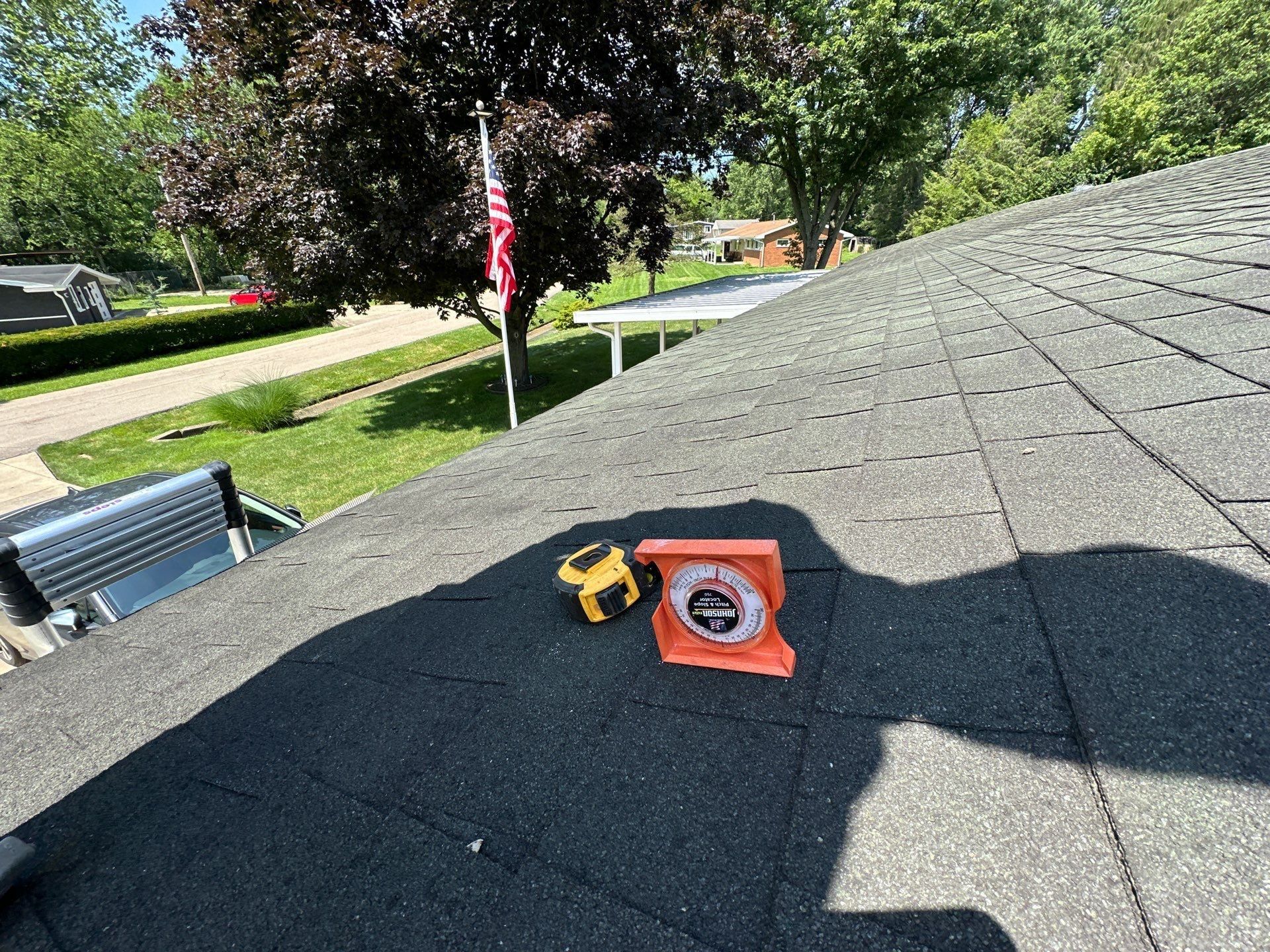 Pitch gauge and tape on old shingles