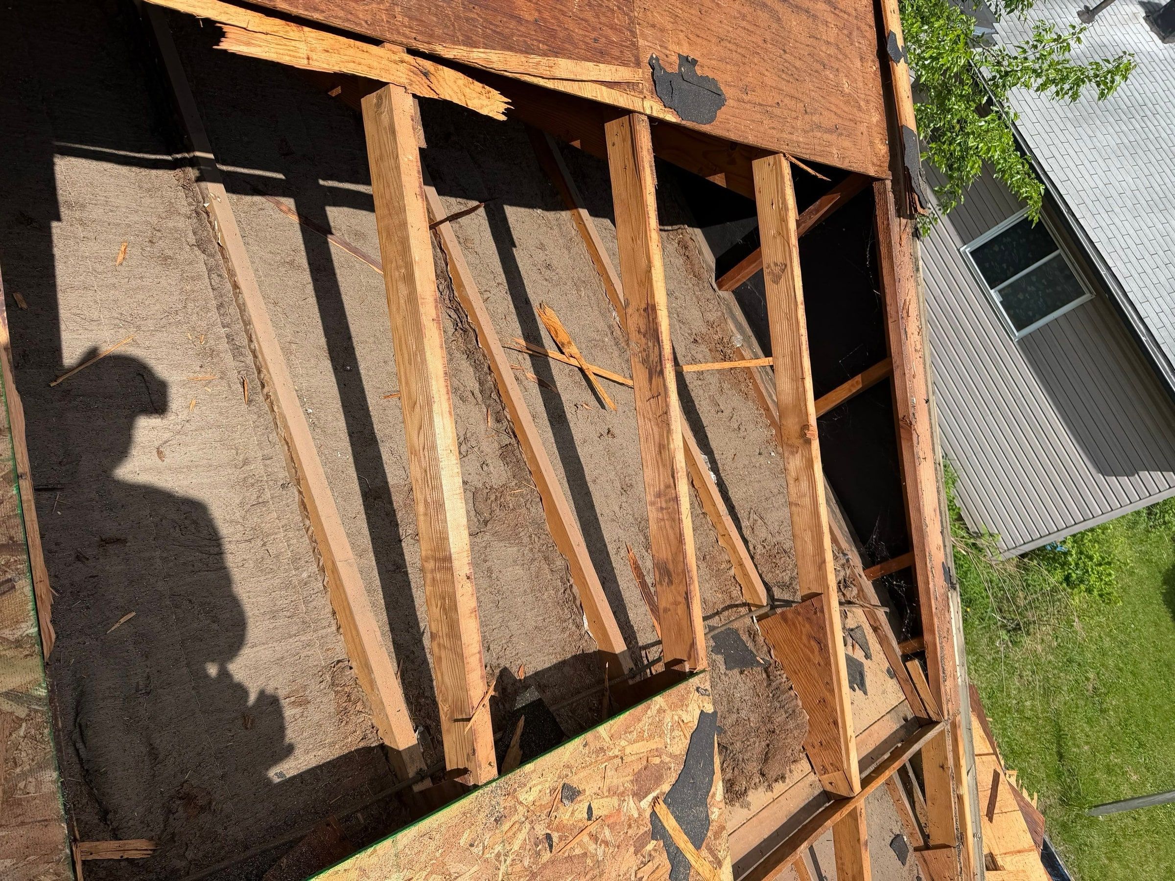 Rafters, fibrous board and new sheathing