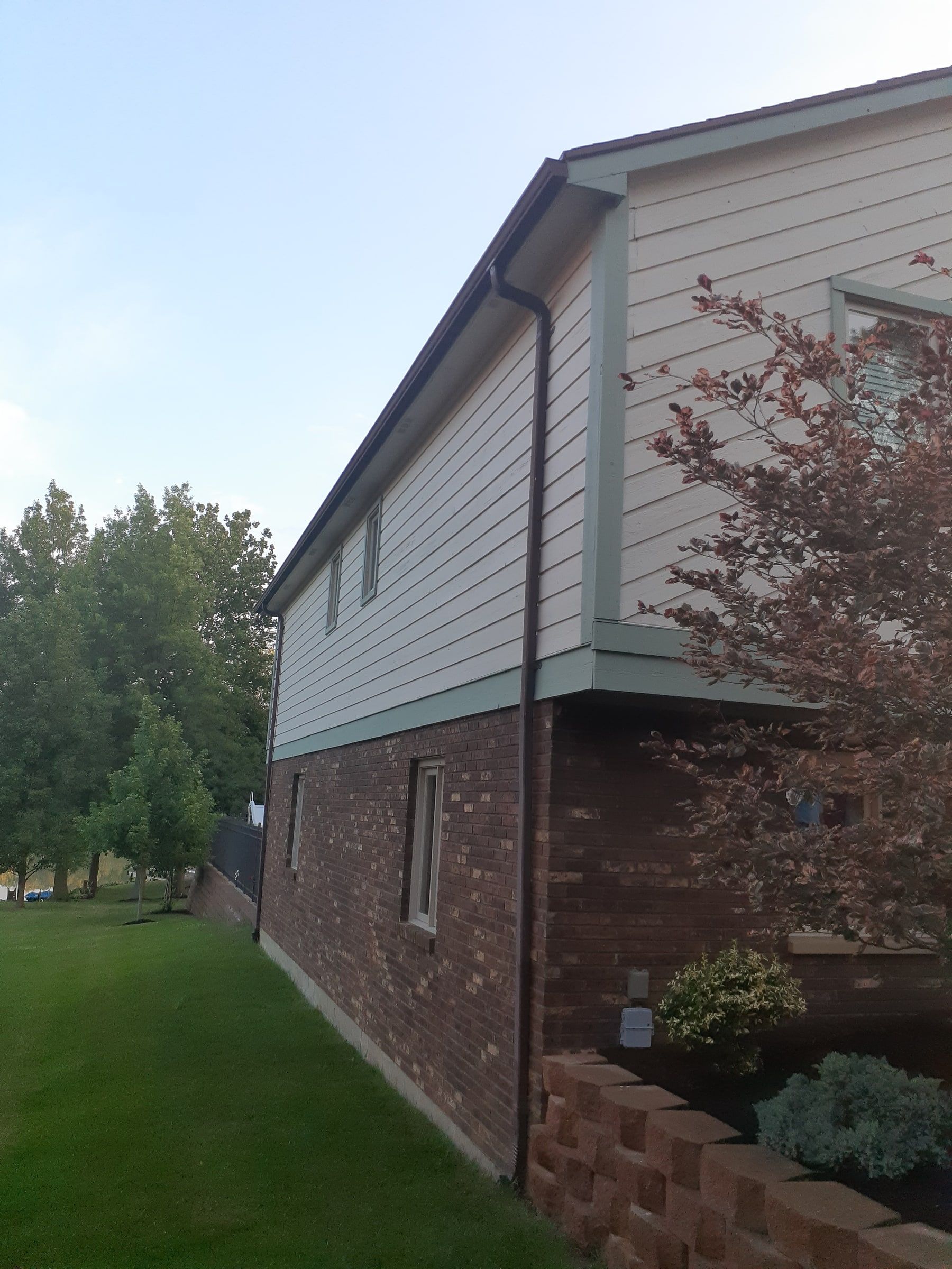 Side of the two story wing with siding above brick, Jamestown, Ohio.