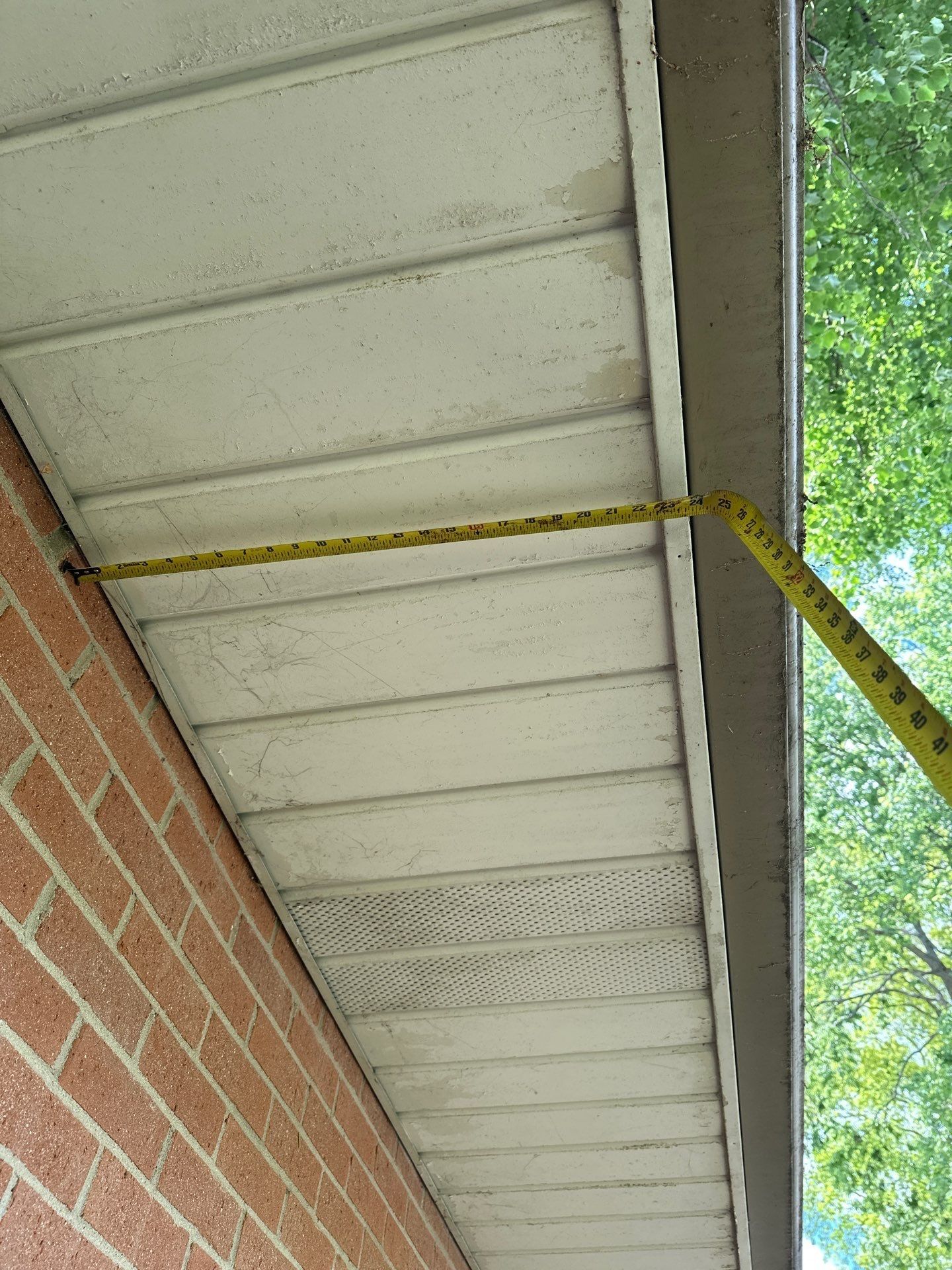Tape across the soffit under the eave