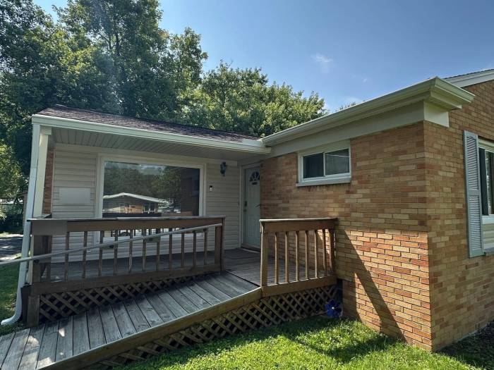 Front of the house with the new white gutters over the porch, Kettering, Ohio.