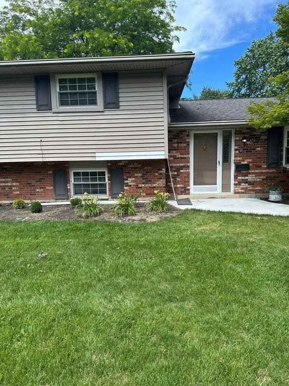The front of the house, with siding above the brick, Beavercreek, Ohio.