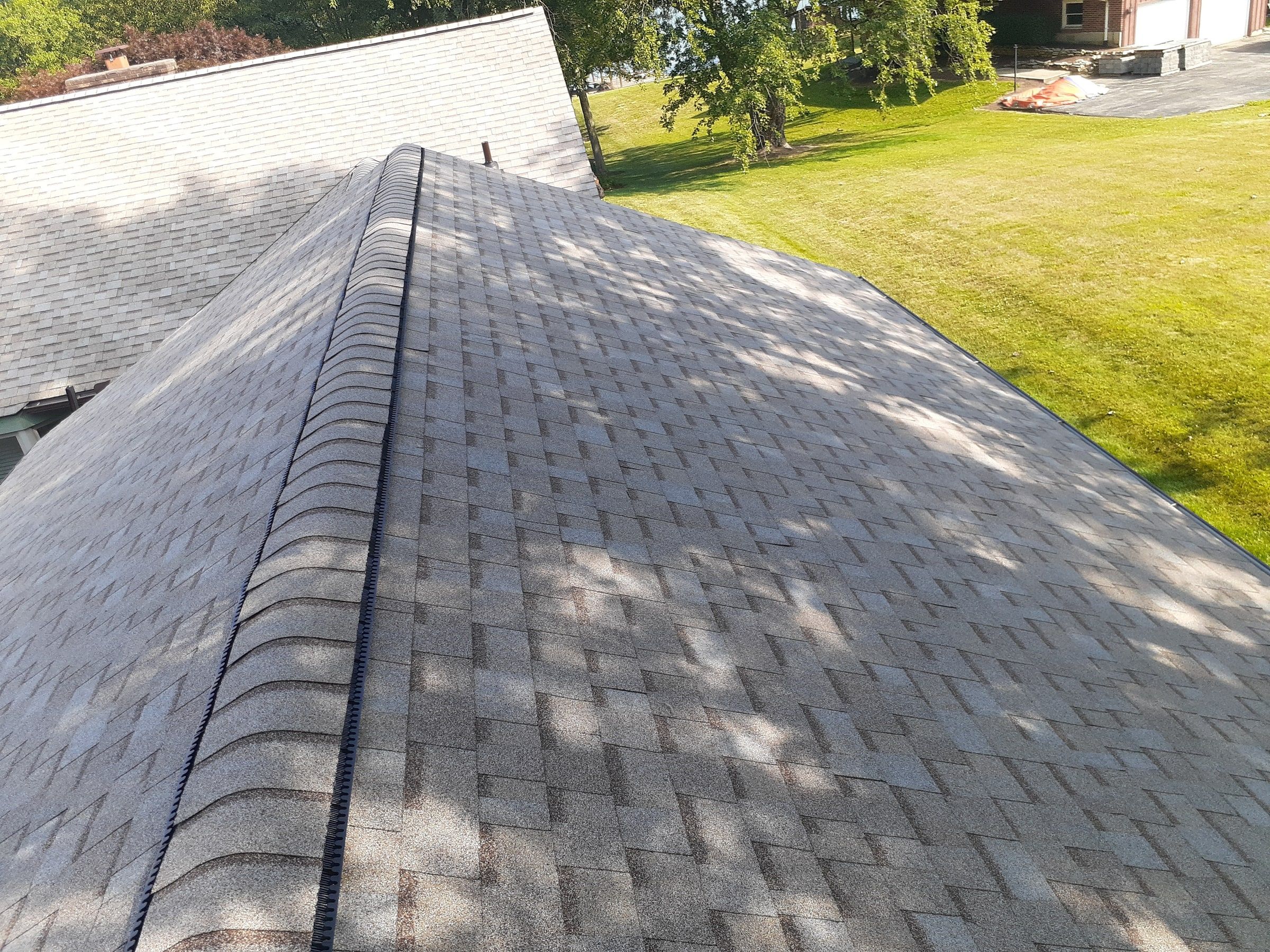 Ridge vent capped along the main ridge in dappled shade, Jamestown, Ohio.