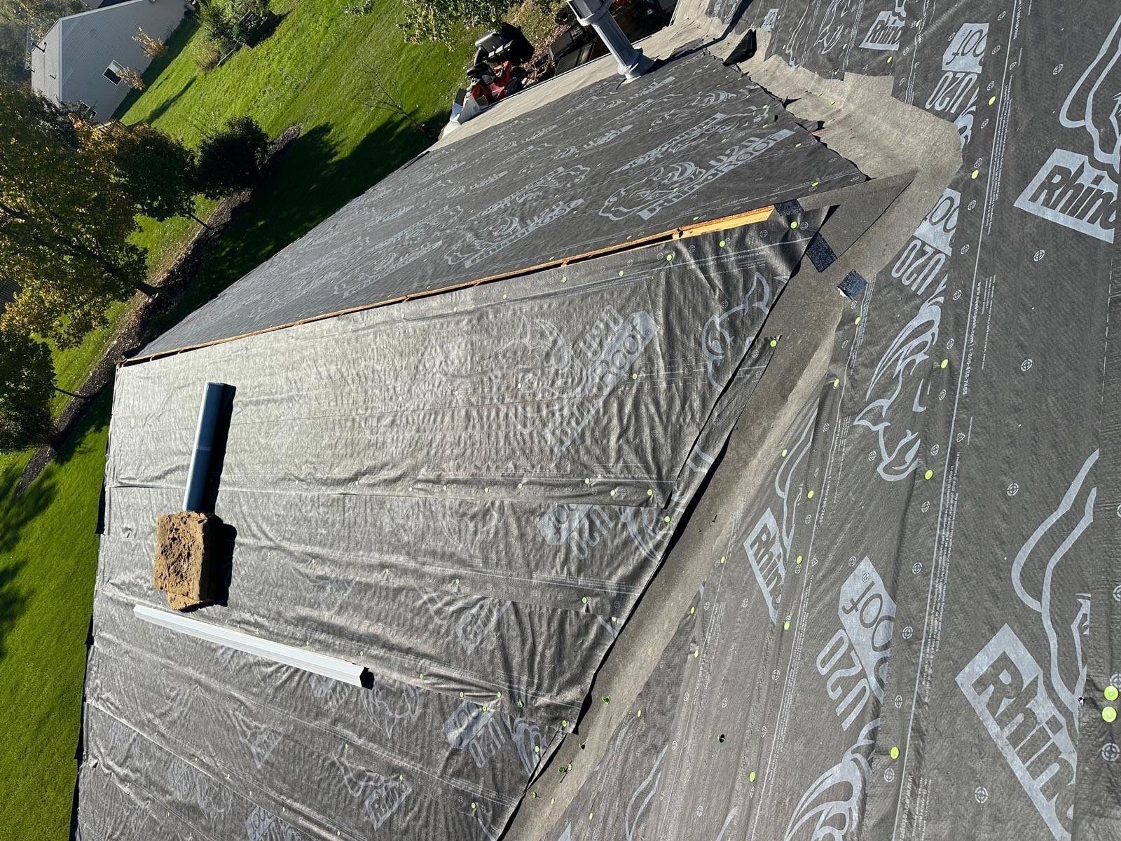 Ice and water shield along the lower edge and underlayment over a gable section with a vent pipe, Beavercreek, Ohio.